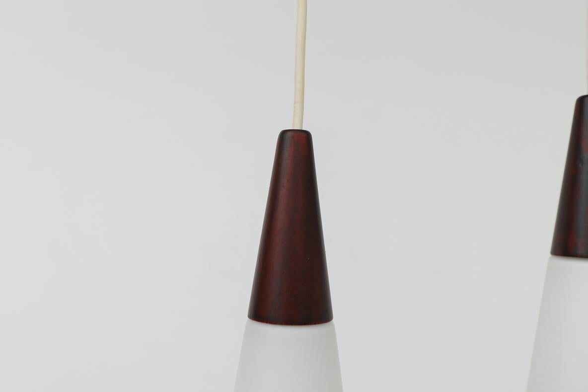 Mid-20th Century Mid-Century Philips Opaline Milk Glass Pendants with Faux Rosewood Tops For Sale