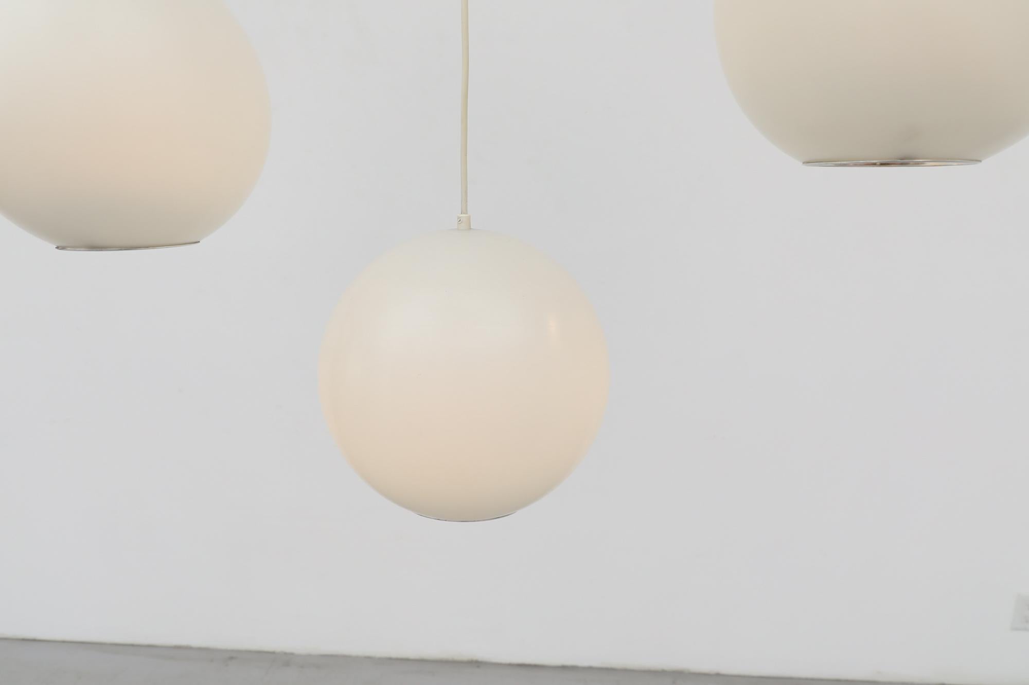 Mid-Century Philips Plexiglass Globe Pendant Lights In Good Condition For Sale In Los Angeles, CA