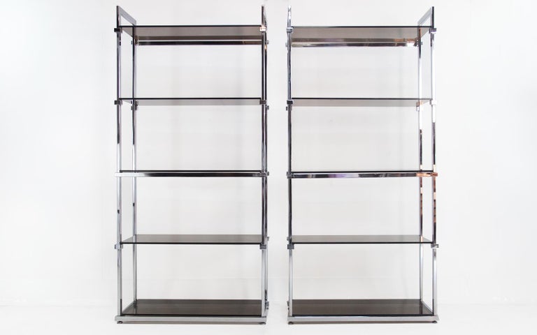 Shelving Units by Pieff

A pair of shelving units designed by Tim Bates and manufactured in the UK by Pieff, circa 1970.

The frame is a beautifully finished chrome, and the shelves are smoked glass. Outstanding design, with great presence,