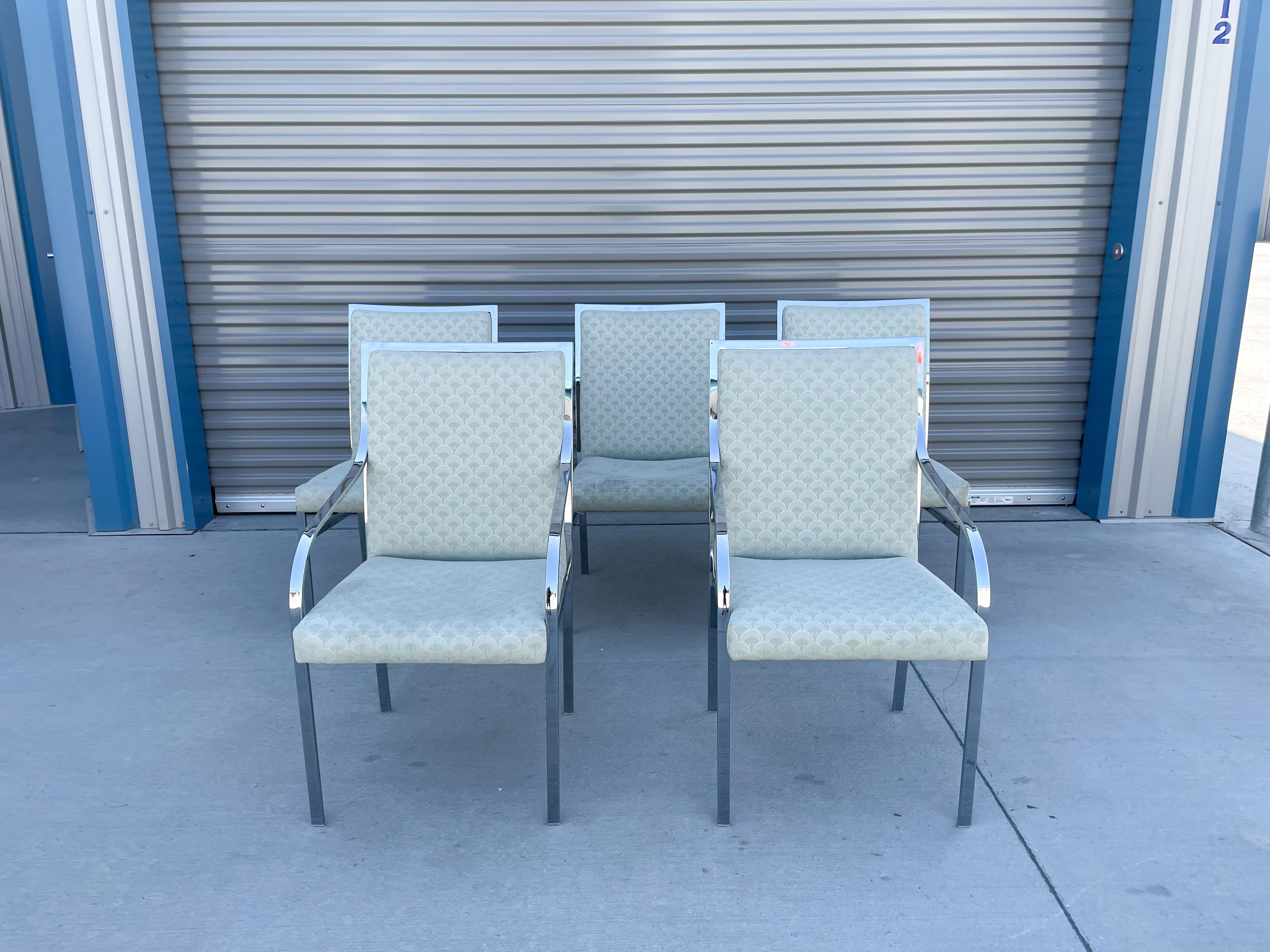 Midcentury chrome dining chair set of six by Pierre Cardin for Dillingham. These vintage chrome dining chairs were design by Pierre Cardin for Dillingham and manufactured in the United States. They feature a perfect stainless steel chrome base with
