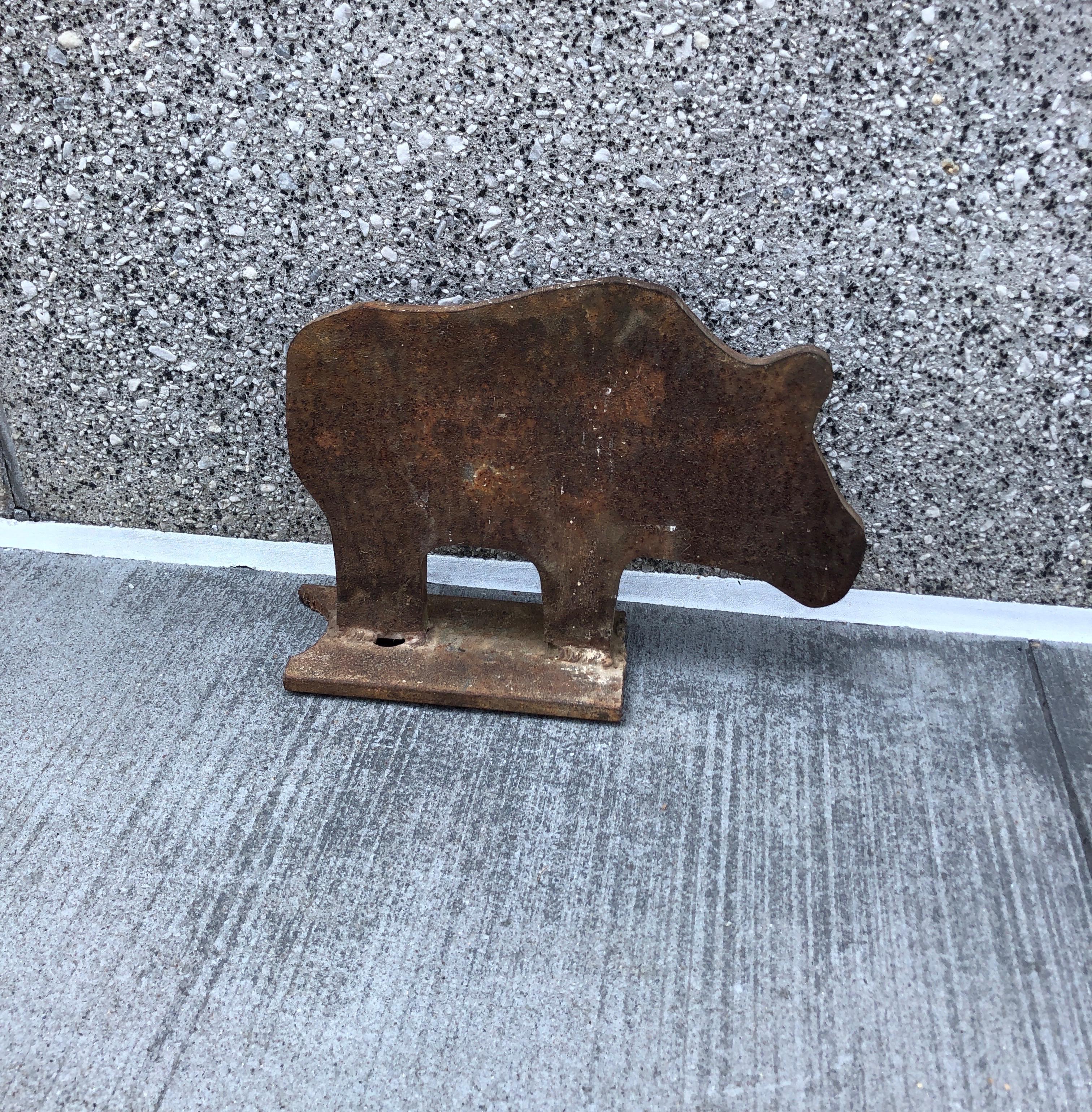 An American mid-century iron boot scraper in the shape of a pig. A whimsical and fun piece of history. Great object and conversation piece.
  