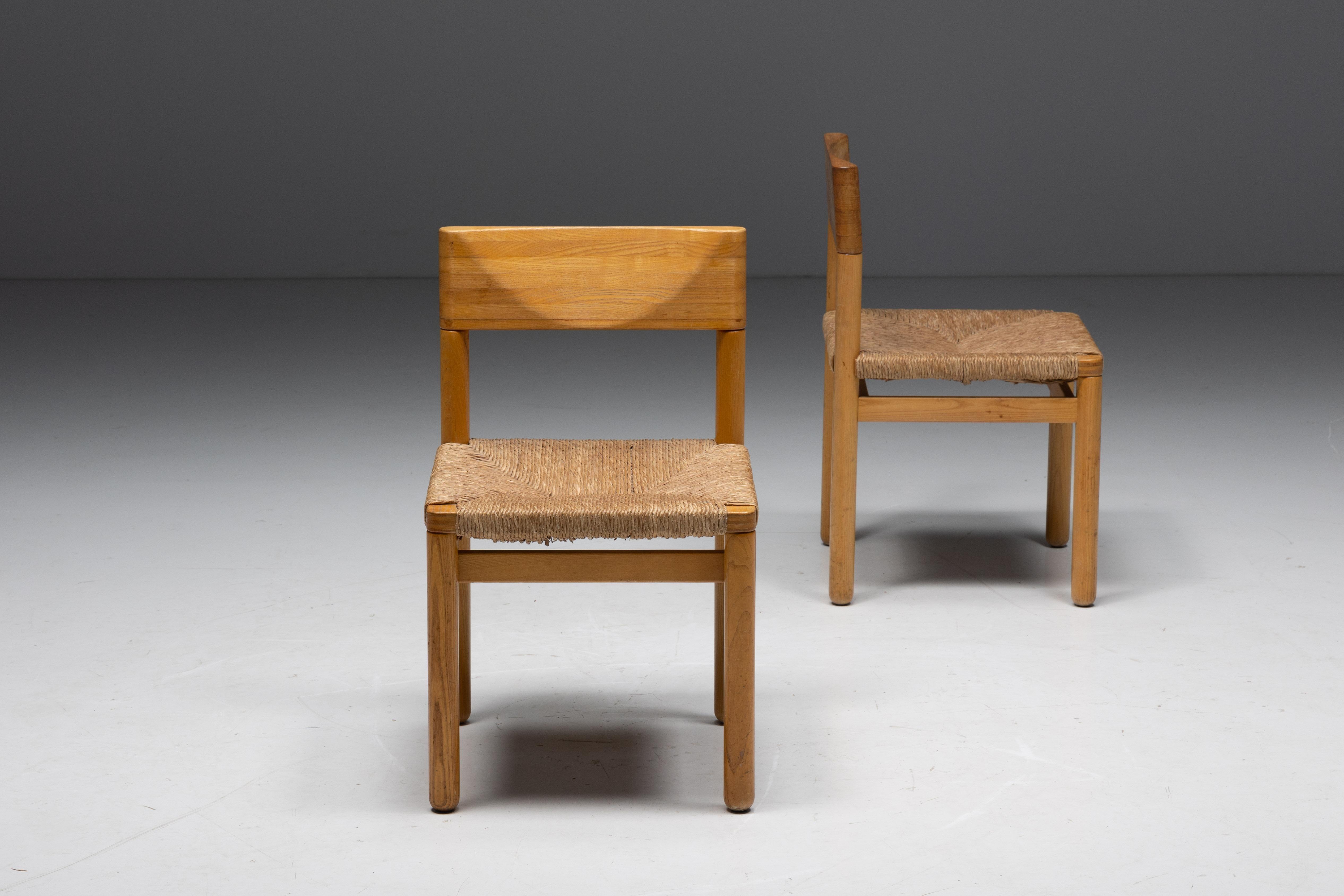 Dining chairs in the style of Charlotte Perriand from the 1960s. These chairs are made of beautiful pine and feature an enchanting straw seat, which adds warmth to their overall design. These chairs are in beautiful original condition and price per