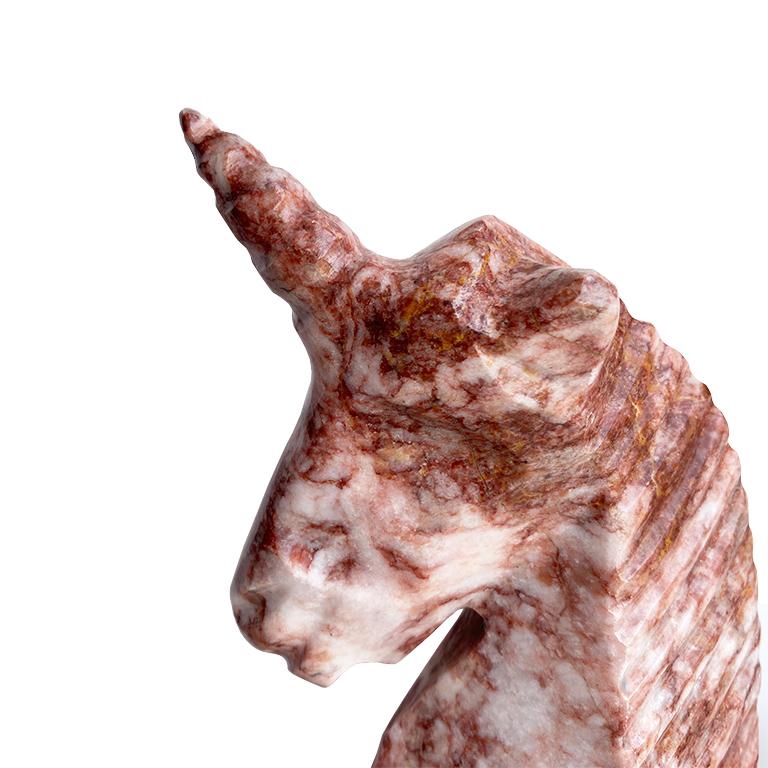 A unique sculpted marble unicorn figure in pink and white marble. A fantastic addition to a bookshelf or nightstand, this hand-carved unicorn is truly one of a kind. 

Dimensions:
6.5