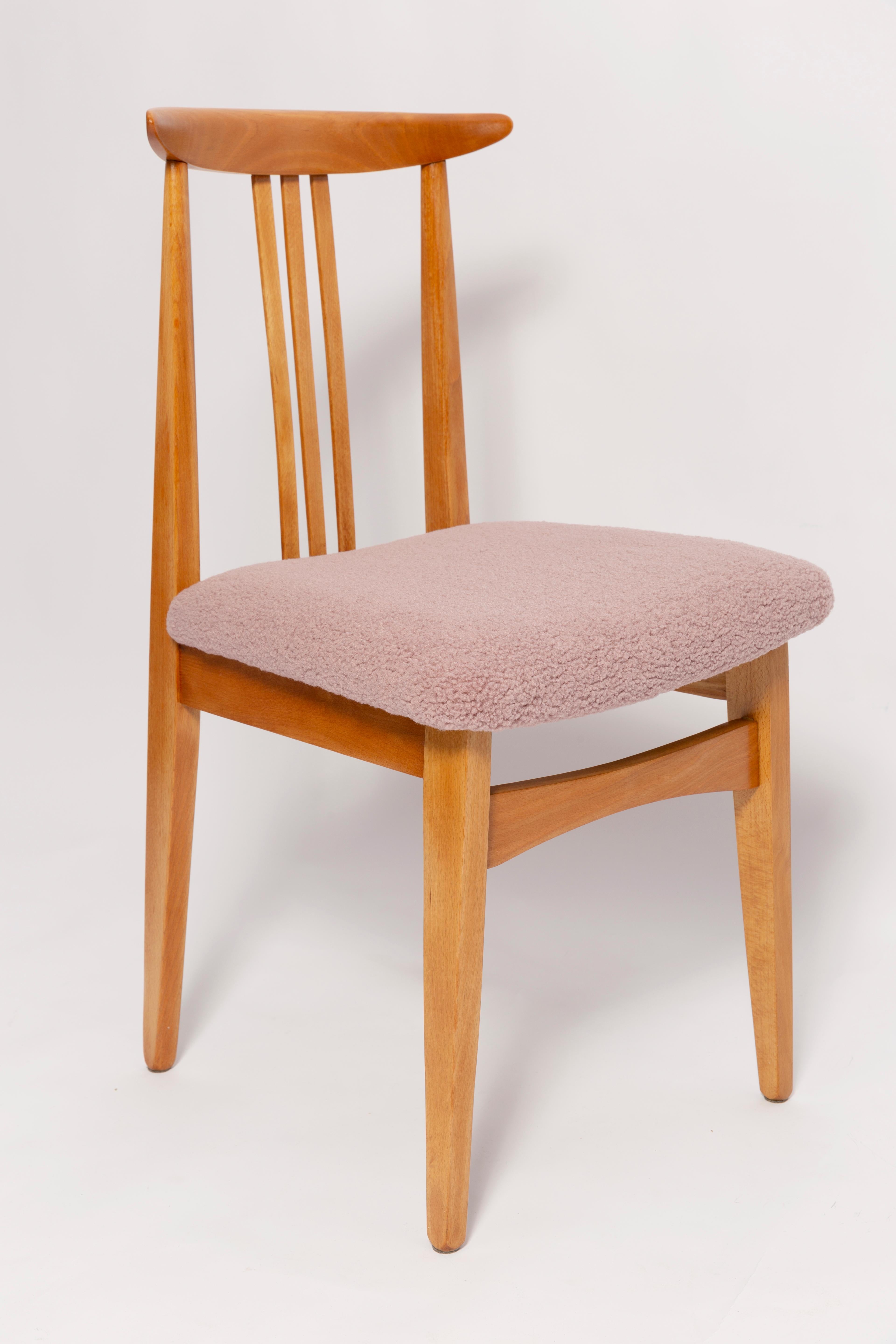 A beautiful beech chair designed by M. Zielinski, type 200 / 100B. Manufactured by the Opole Furniture Industry Center at the end of the 1960s in Poland. The chair is after undergone a complete carpentry and upholstery renovation. Seats covered with