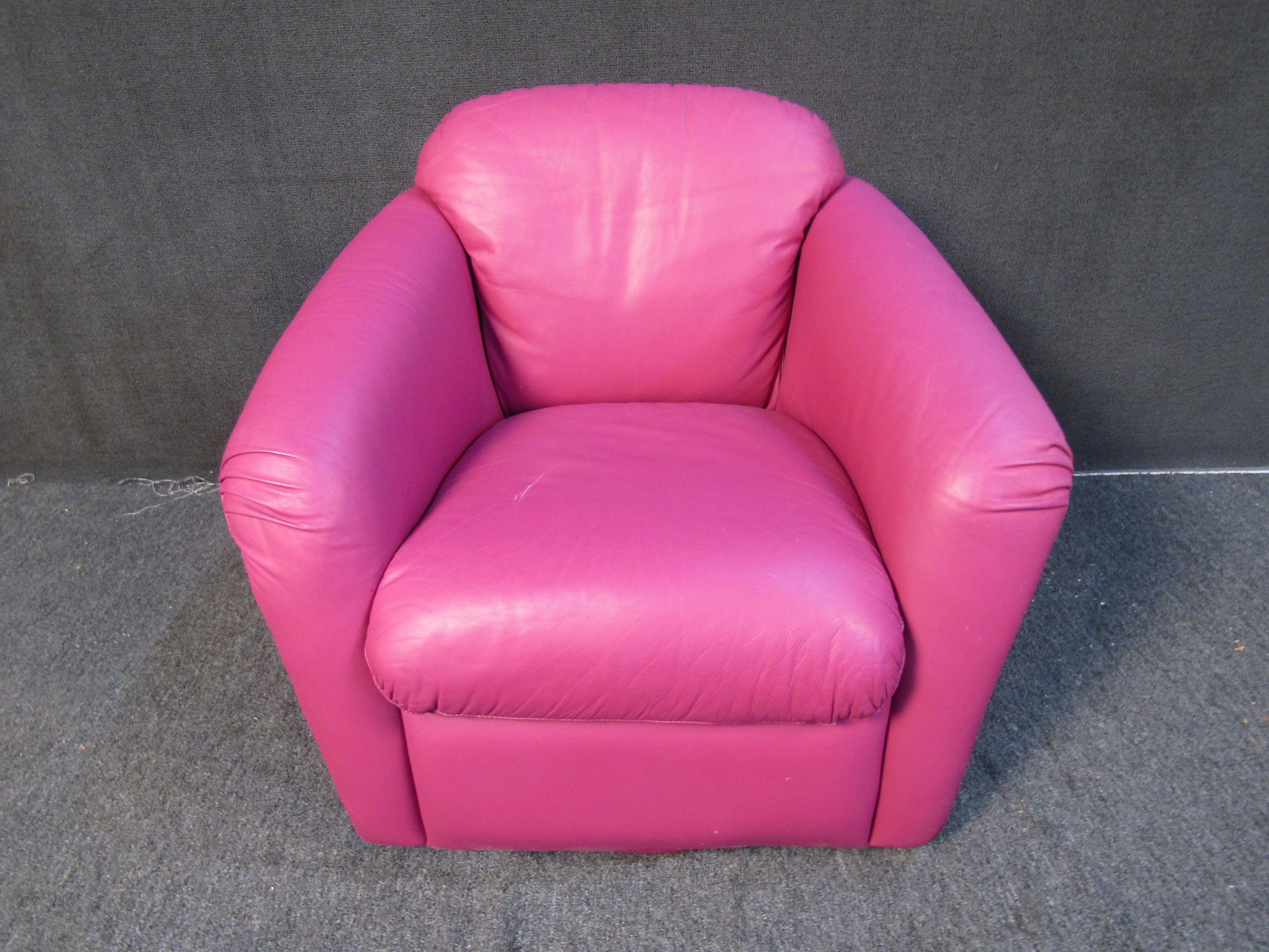 Colorful and plush pink mid-century leather lounge chair with a swivel base. Please confirm item location with seller (NY/NJ).