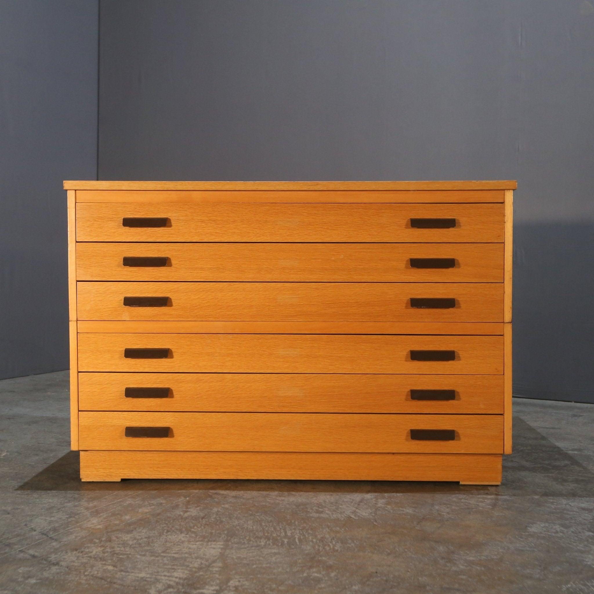 Introduce a touch of retro charm to your home office or living space with our stunning Mid-Century Plan Chest. Crafted from high-quality wood and featuring a sleek, minimalist design, this piece is both functional and stylish. With six spacious