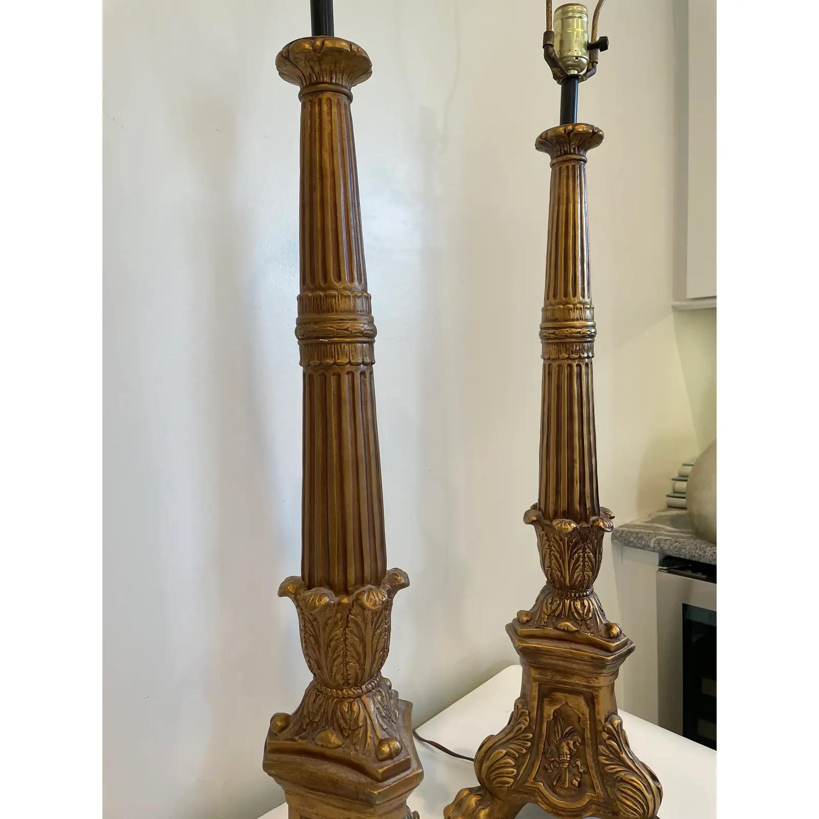 Beautiful imposing baroque stick lamps. Great detail in fluting and heraldic claw footing.