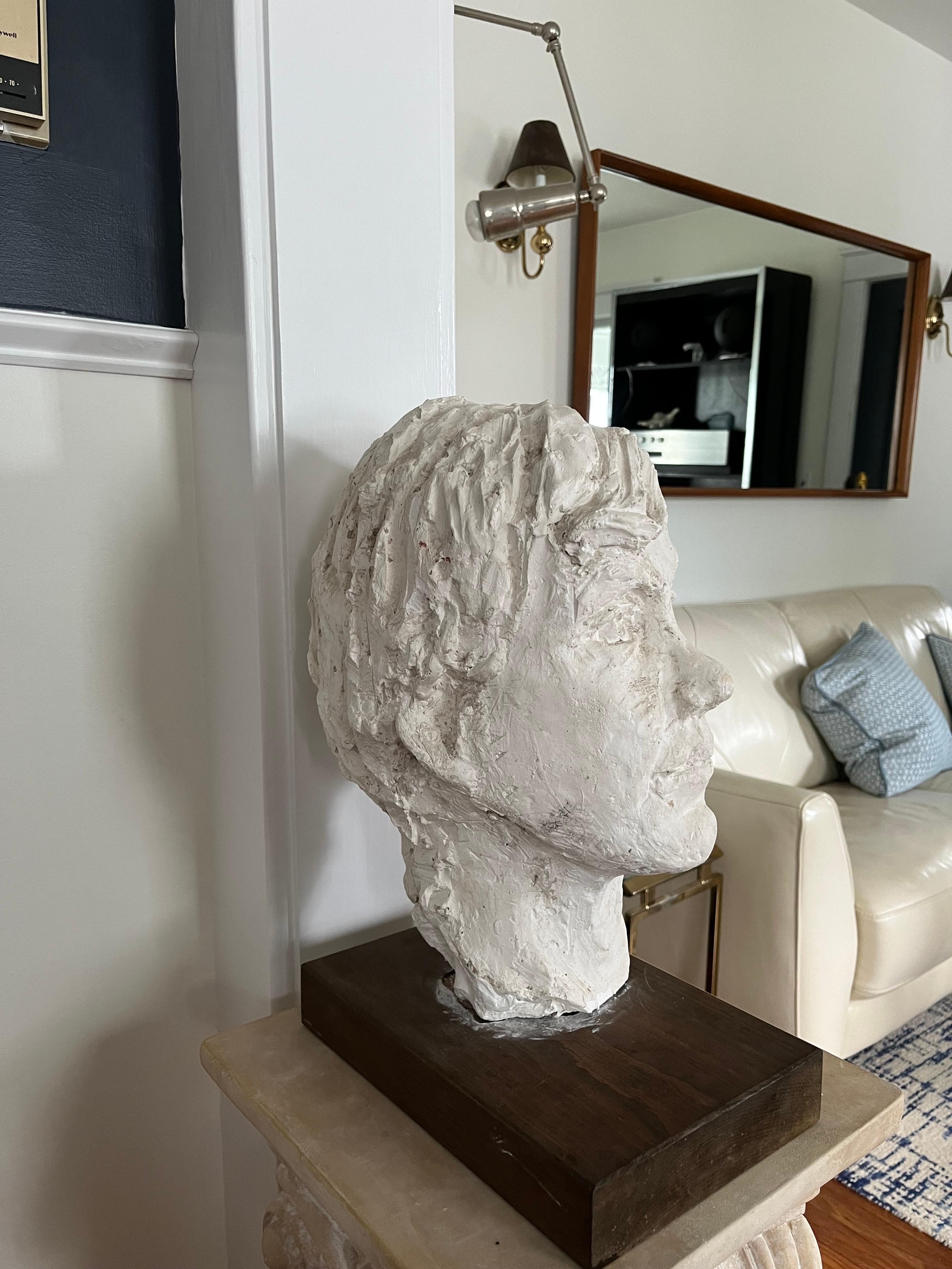 Spectacular life size bust of a male. Great deep details and expression. Sit on a wood plinth base. 
