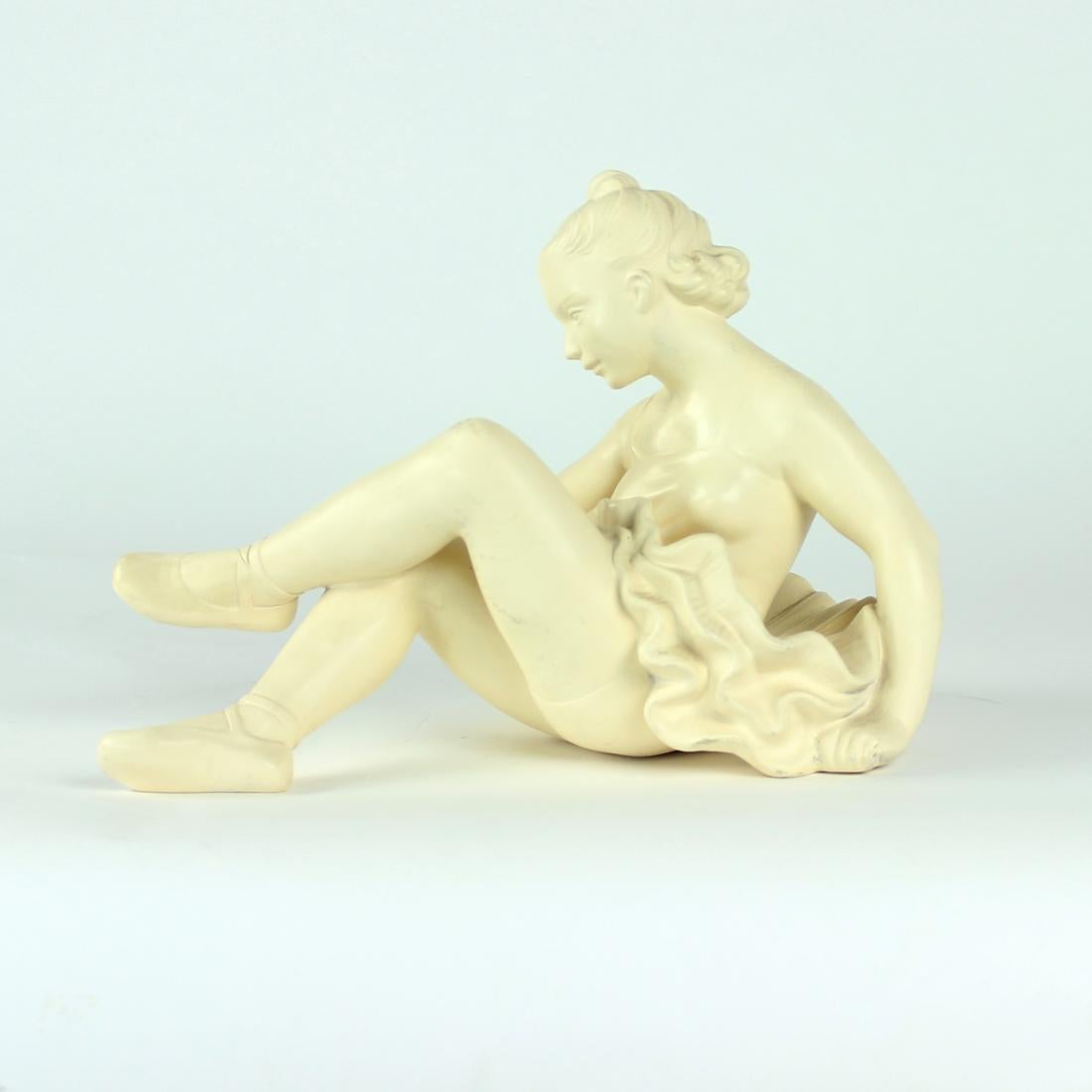 Beautiful vintage statue of a sitting ballet dancer. Produced by Jihokera in Czechoslovakia in the 1960s. The sculpture is in an excellent condition. There are no damages. Minor age wear visible on the finish, which in our opinion only adds to the