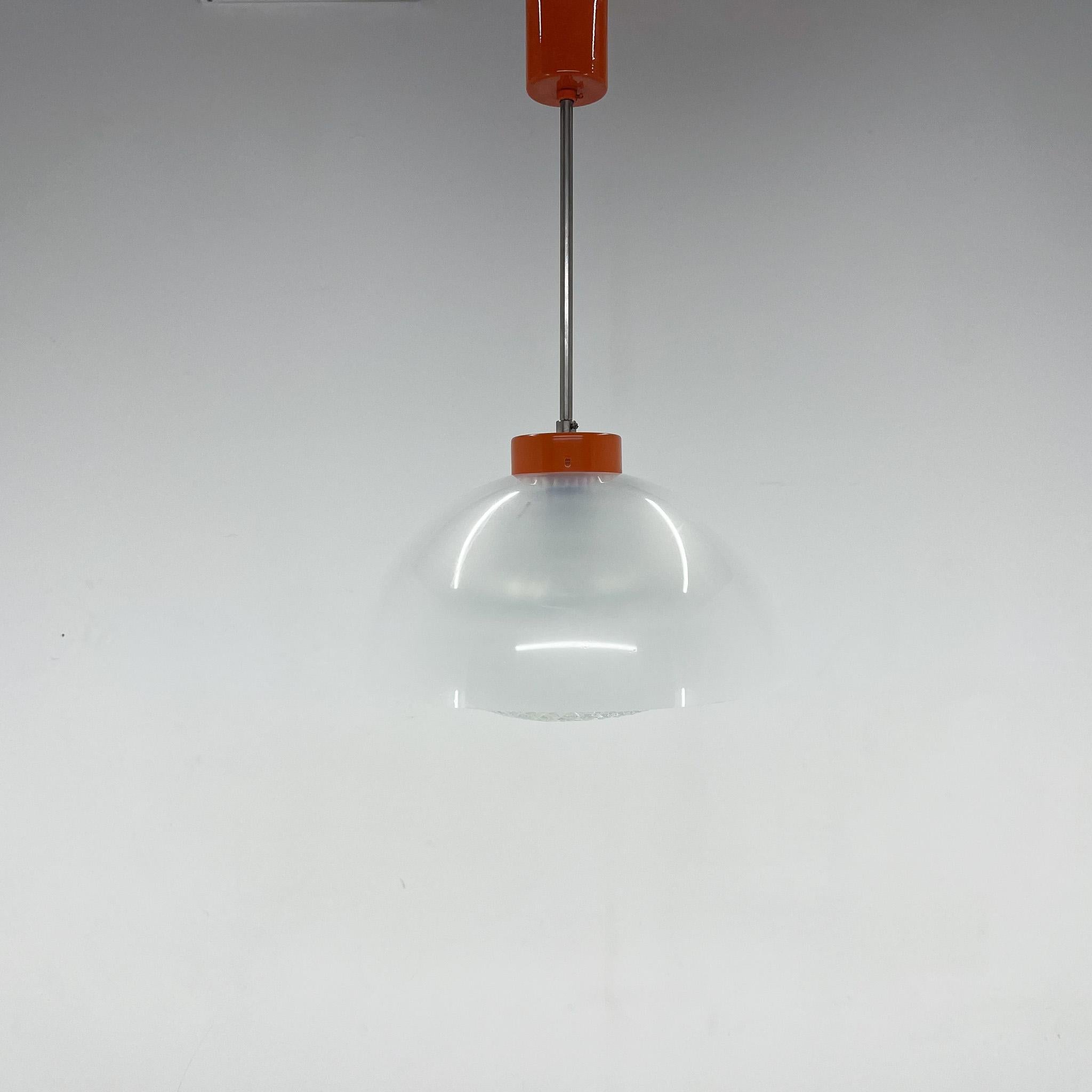 Vintage pendant made of transparent plastic and pressed glass.