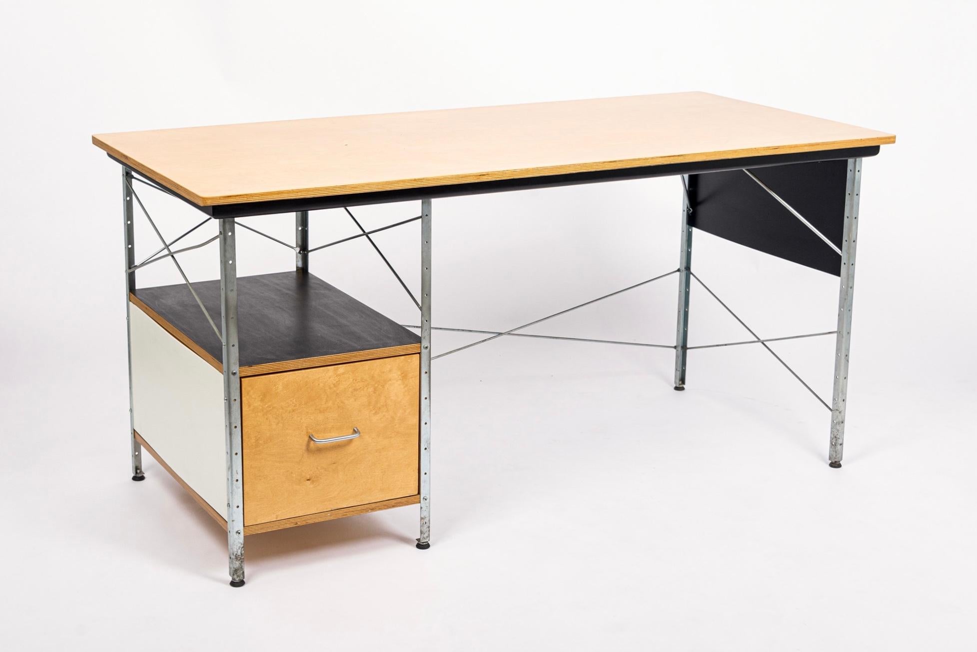 This mid century Eames Desk Unit was designed by Charles and Ray Eames for Herman Miller in 1952 and has remained an American mid century modern classic ever since. This iconic office desk features a uniquely modern design with clean, minimalist,