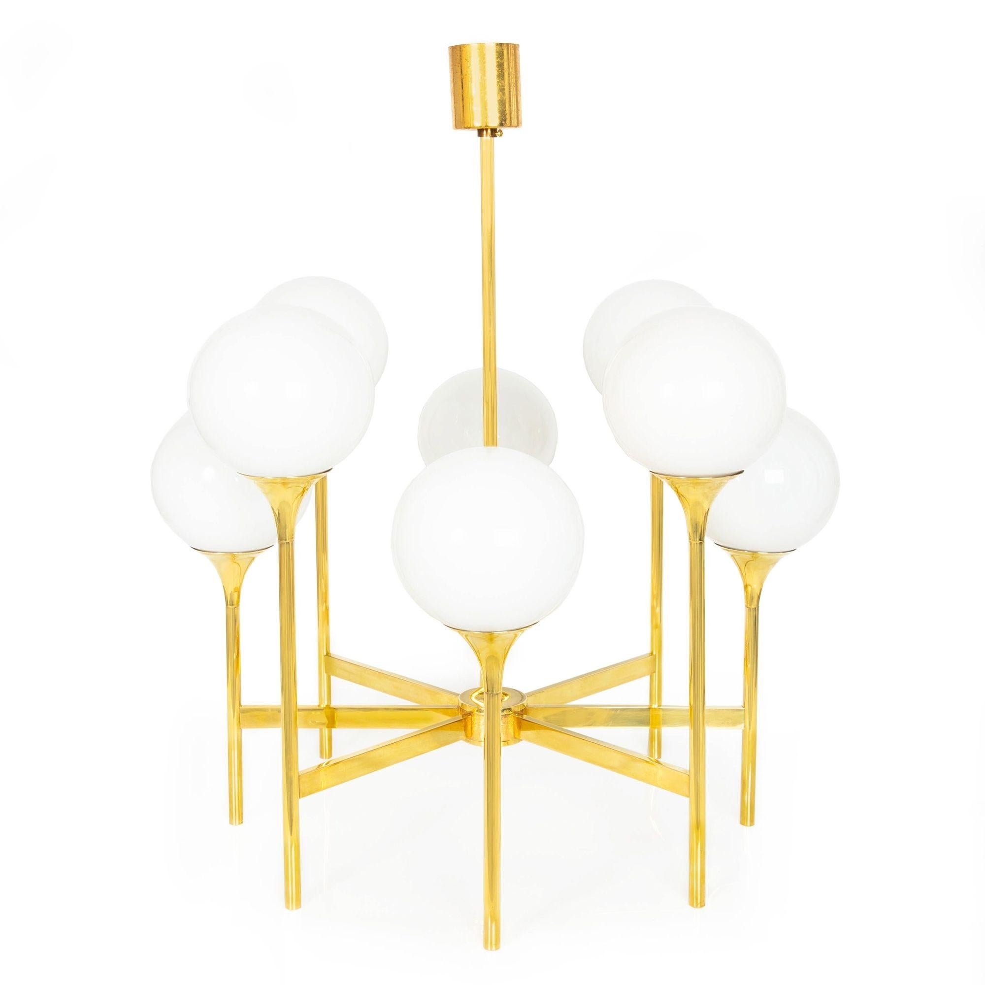 A MID-CENTURY POLISHED BRASS EIGHT-LIGHT CHANDELIER
Designed by Gaetano Sciolari ca. 1970  unmarked
Item # 311JBP02P

This sleek and austere chandelier is a quintessential representation of Gaetano Sciolari's design ethos from the 1970s. It features