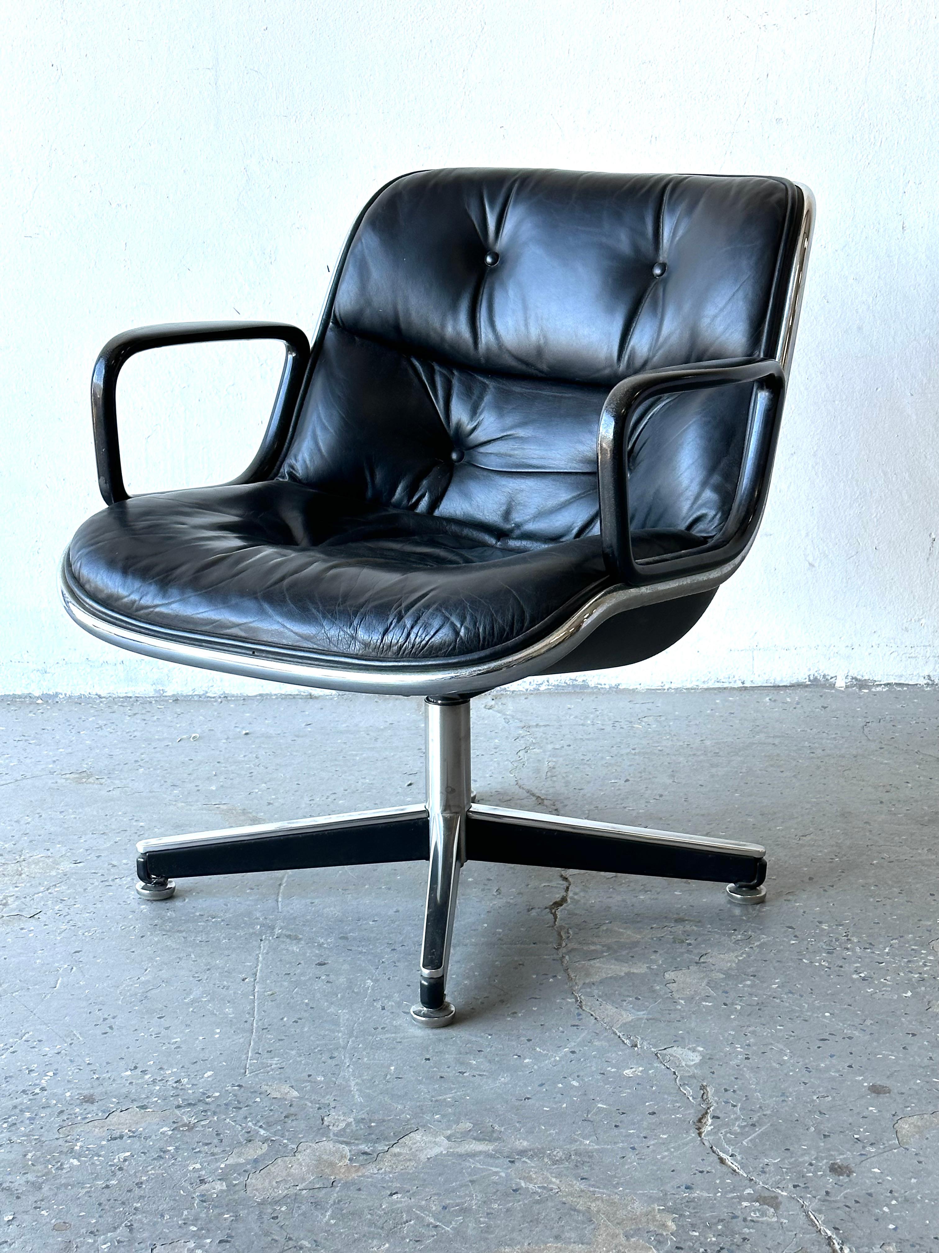 Offering the classic Pollock Executive Chair in its original black leather, black steel frame, and vintage 4-star base, chair reclines. Chair was made in1972.

Dimensions

Arm to arm 26 inches wide front to back 26 inches deep Floor top of back