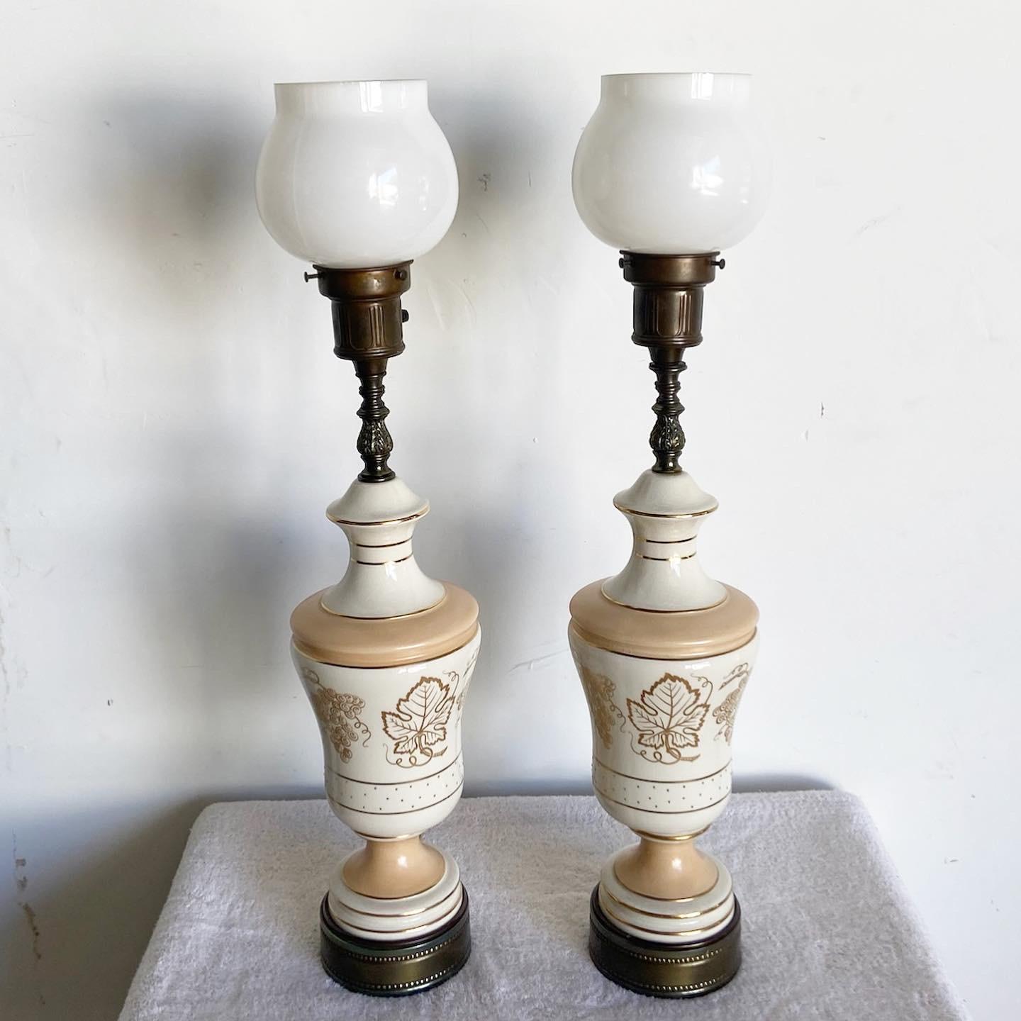 Illuminate your space with the wonderful pair of vintage mid century table lamps. Each lamp features a hand-painted porcelain body and glass lamp shades, combining elegance and vintage charm.

Wonderful pair of vintage mid century table