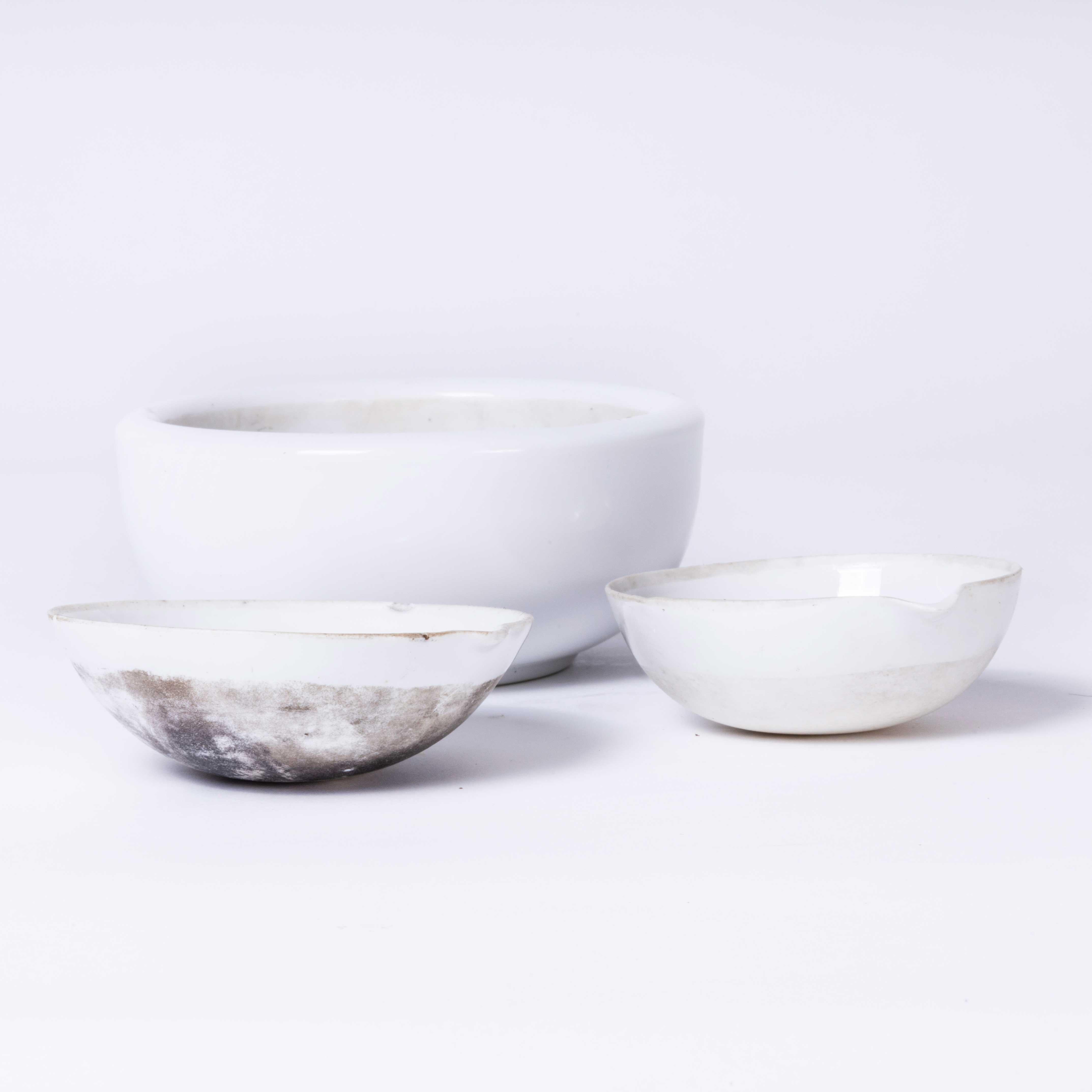 Mid Century Porcelain Crucible Laboratory Bowls - Set Of Three. Made in Czech. A set of three fine white porcelain bowls two with poring spouts and one heavy solid mixing bowl. In excellent vintage condition.

Workshop Report:
Our workshop team
