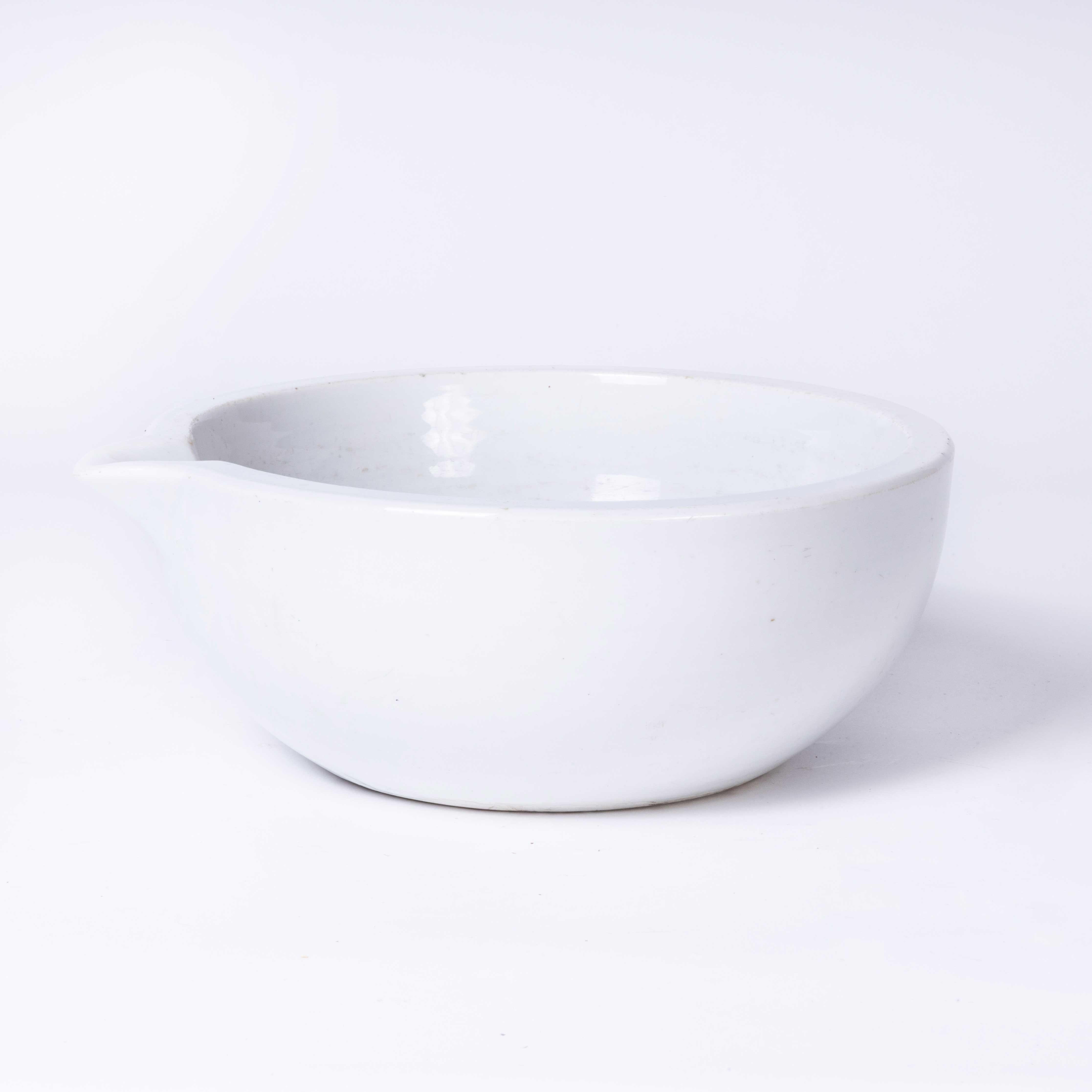 Mid Century Porcelain Shallow Crucible Laboratory Bowl. Made in Czech. 

A white porcelain bowl with a smooth finish and a spout for pouring. In excellent vintage condition.

Workshop Report:
Our workshop team inspect every product and carry out any