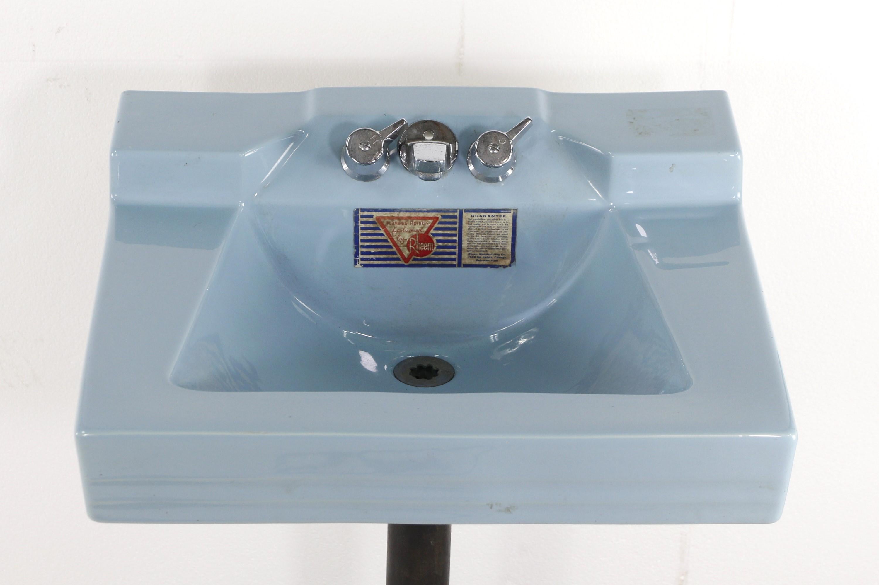 Mid 20th Century Mid-Century Modern light blue wall sink with the original nickel plated hardware. Manufactured by Rheem. Never used, still with the original manufacturer's label on it. This can be seen at our 400 Gilligan St location in Scranton,