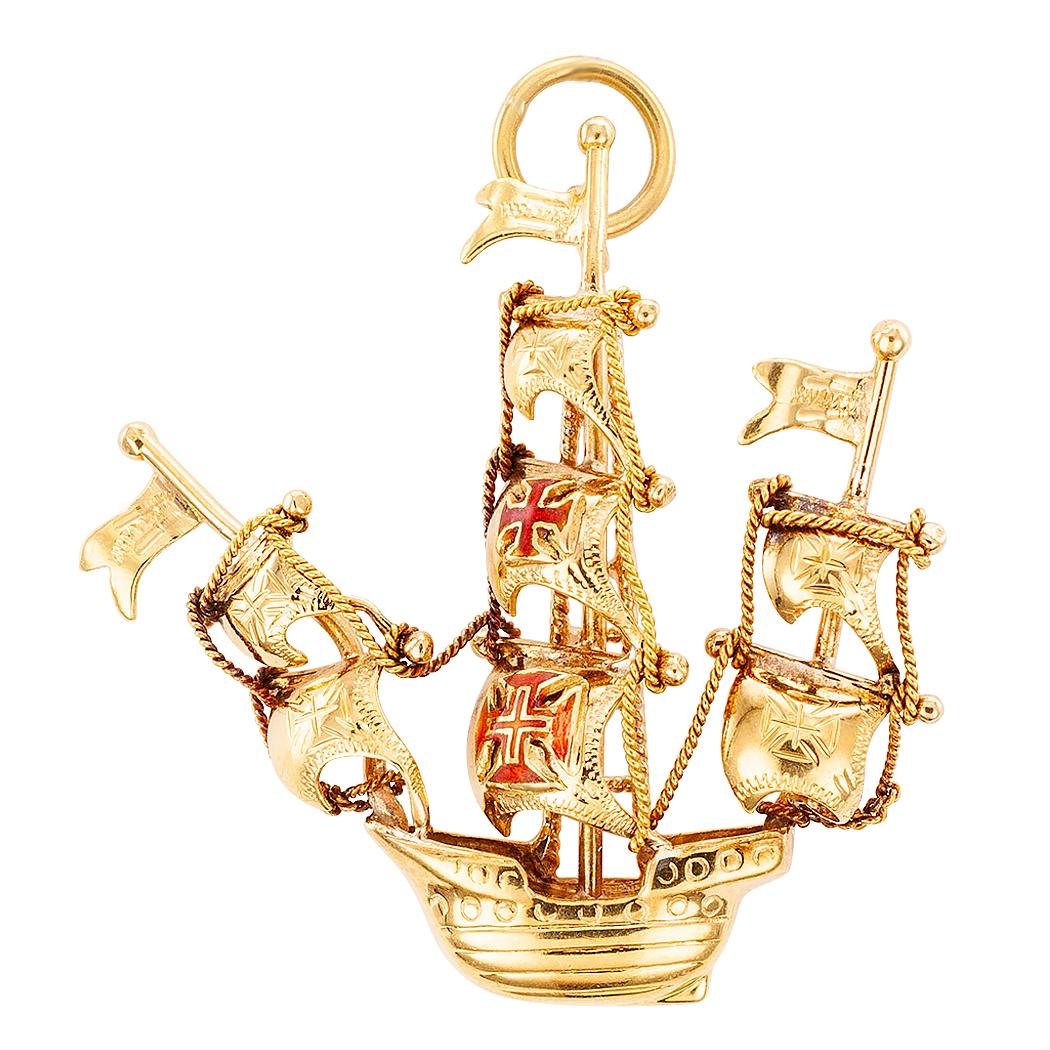 Mid-century Portuguese galleon enamel and gold charm pendant circa 1950. The handcrafted, 19-karat gold design features three masts at full sail, the latter decorated with elements typical of ships from the period being represented by the charm. Two