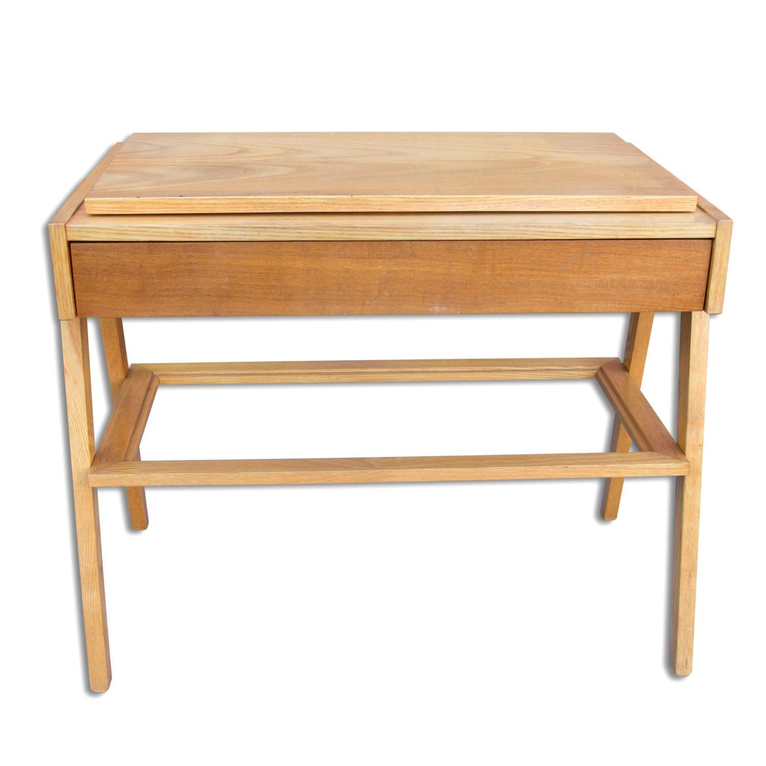 Midcentury positioning TV table. It features a solid oak or ashwood structure and one drawer in walnut. Its design is associated with world-famous EXPO 58 exhibition in Brussels. In very good vintage condition.

   