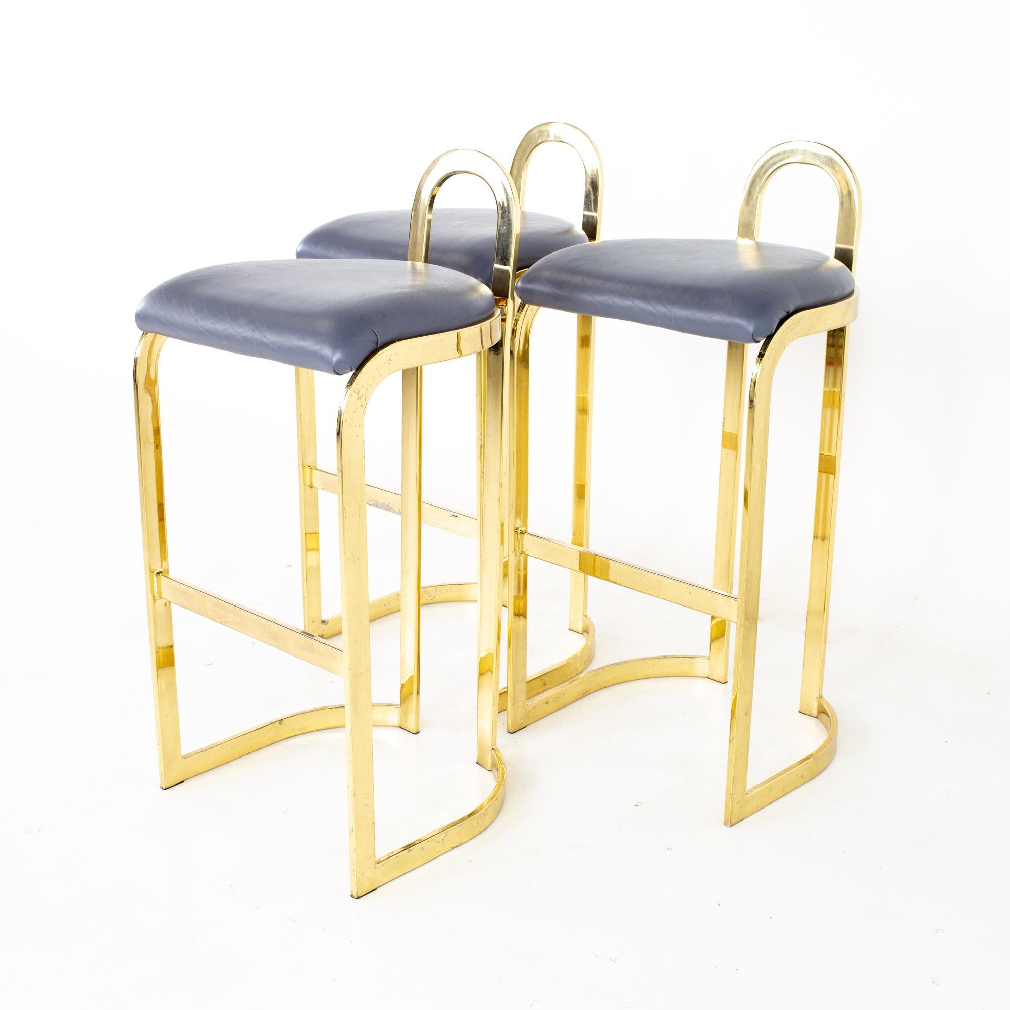 Mid century post modern brass bar stools - set of 3
Bar stools measures: 18.5 wide x 17.75 deep x 38.25 high, with a seat height of 31.75 inches 

All pieces of furniture can be had in what we call restored vintage condition. That means the piece