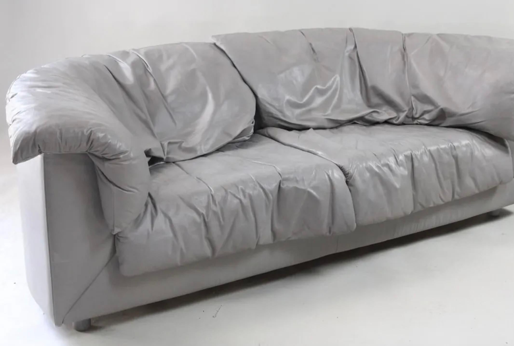 Mid century post modern De Sede gray leather long curved back Pillow sofa. Very unique half moon shaped designer loveseat with very high end thick soft Leather upholstery. Very comfortable and stylish high quality sofa. De Sede embroidered to the