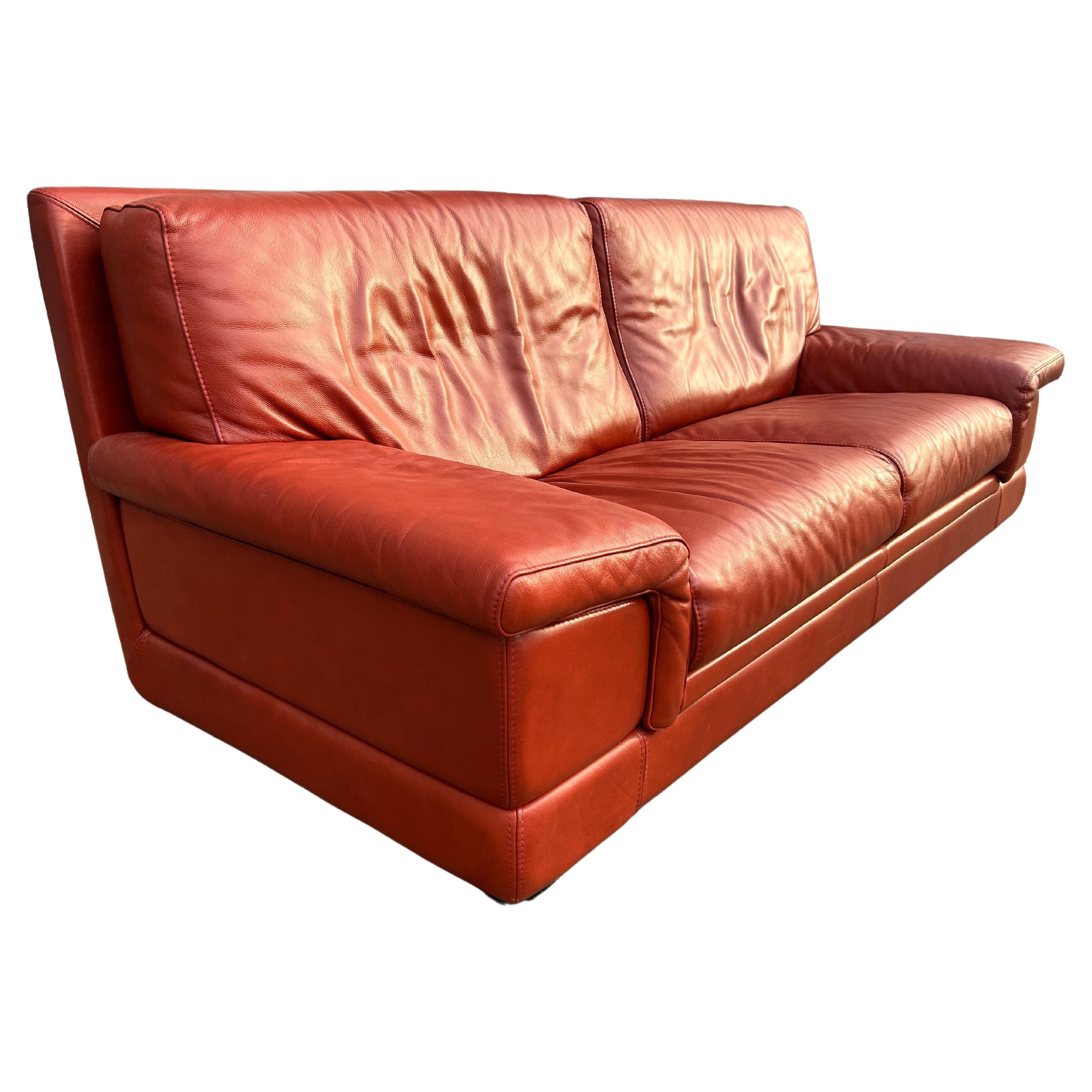 Beautiful Mid Century Italian Burnt Sienna Red Leather 3 seat Sofa by Roche Bobois. Wonderful condition very clean - ready for use. Clean soft thick leather. Great Design - Labeled under cushions and Dust cover. Located in Brooklyn NYC. 

Original