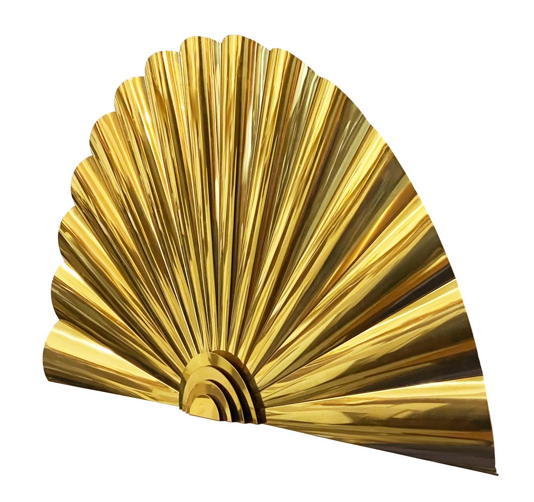 A large fan wall sculpture by C. Jere circa 1989. It features mirror polished brass. Large striking piece.