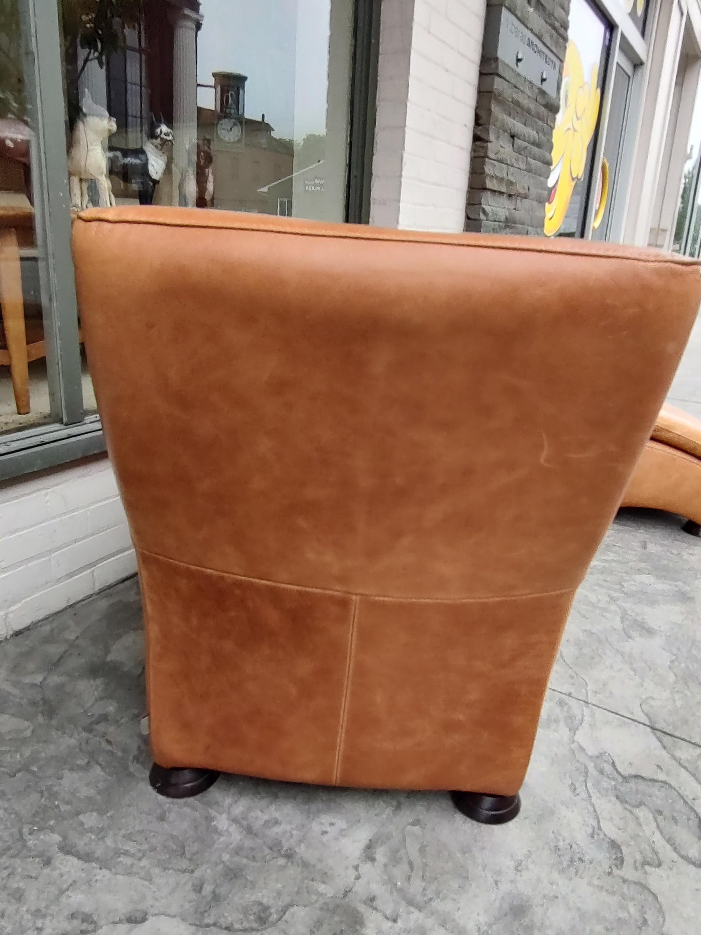 Fabulous leather lounge club chair with an ottoman in the style of Gerard Van Den Berg. Very deep and luxurious chair which you totally relax in with your feet up on the ottoman. In excellent vintage condition with minimal wear, some minor stains