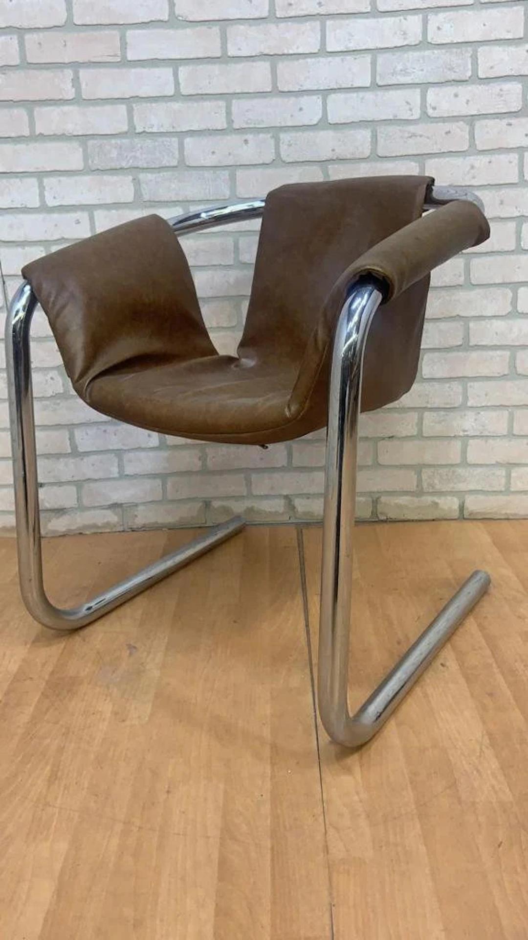 Mid Century Postmodern Chrome Vecta Zermatt Sling Lounge Chair by Vecta Group in Brown Leatherette 

These stunning postmodern sling Vecta Zermatt lounge chairs were designed by Duncan Burke and Gunter Eberle for Vecta Group and manufactured in