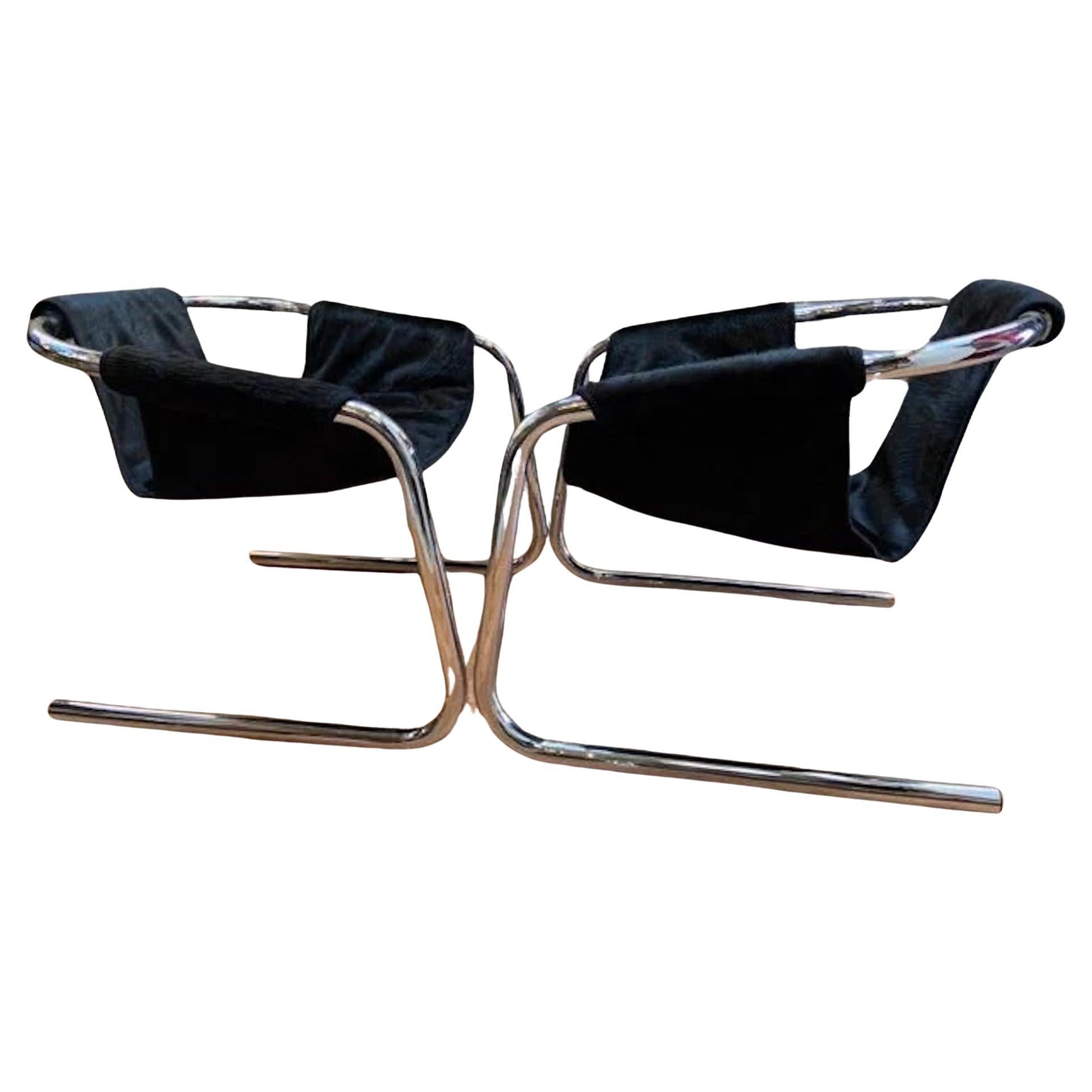 Mid Century Postmodern Chrome Vecta Zermatt Sling Lounge Chair by Vecta Group Newly Upholstered in a High End Black Hide - Pair

These stunning postmodern sling Vecta Zermatt lounge chairs were designed by Duncan Burke and Gunter Eberle for Vecta
