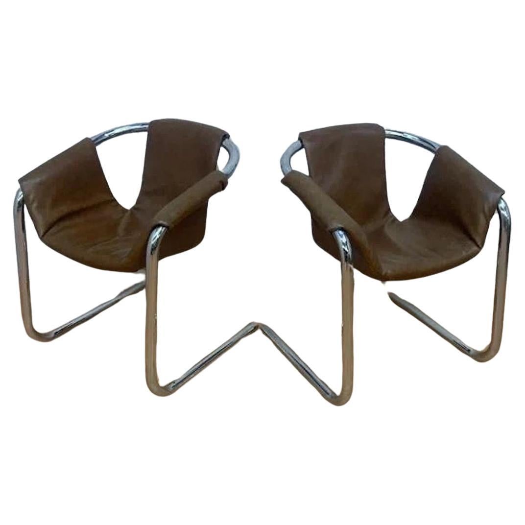 Mid Century Postmodern Vecta Group Style Chrome Sling Lounge Chair in Brown Leatherette- Pair

These stunning postmodern sling lounges are styled after the Vecta Zermatt chairs by Duncan Burke and Gunter Eberle for Vecta Group and manufactured in