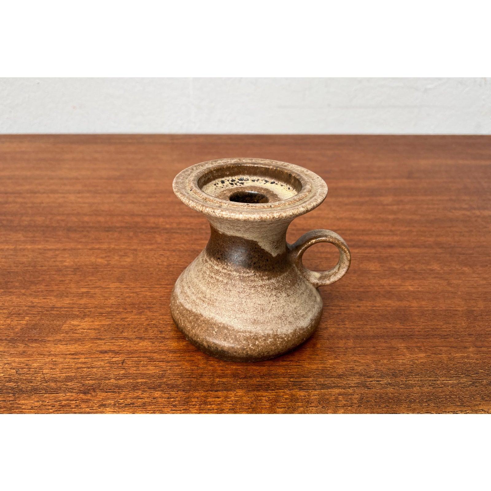 Mid-Century Pottery Candleholder from Steuler, WGP West German, 1960s, in Very Good conditions. Designed 1960 to 1969 This piece has an attribution mark.

Additional information:
Materials: Ceramic
Color: Brown
Styles: Mid-Century Modern
Country of
