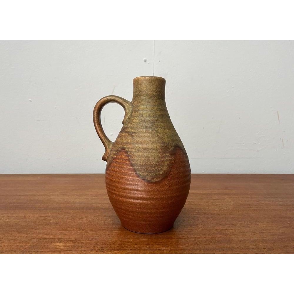 Mid-Century West German Pottery WGP Brutalist Carafe Vase from Dümler & Breiden, 1960s, in Very Good conditions. Designed 1960 to 1969 This piece has an attribution mark.

Additional information:
Materials: Ceramic
Color: Brown
Styles: Brutalist,