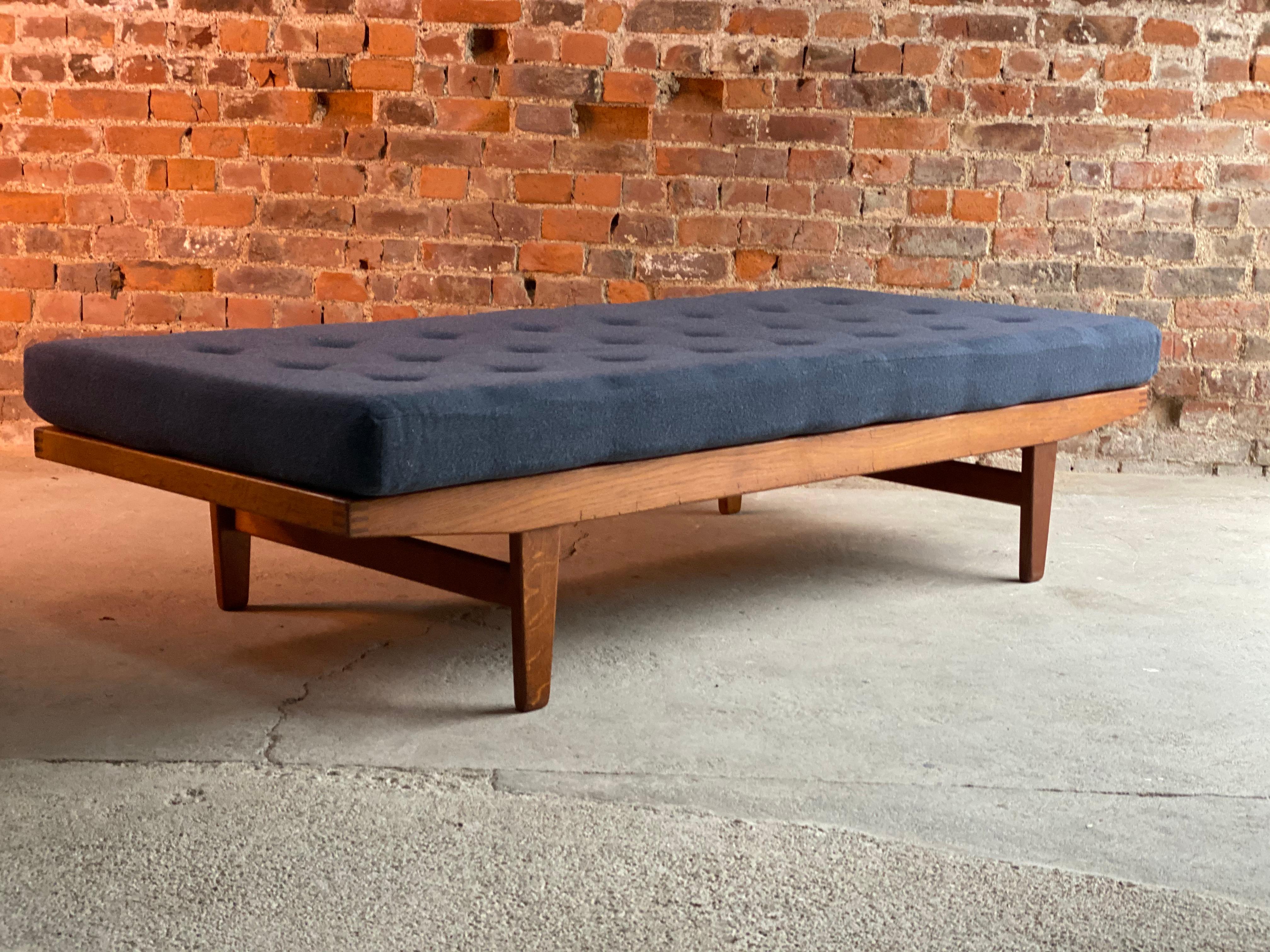 Midcentury Poul M. Volther model H9 daybed FDB Mobler Danish, circa 1960s

Fabulous Poul M. Volther model H9 daybed for FDB Mobler, circa 1960, the button back blue wool covered mattress over beech frame, with slats, makers mark to