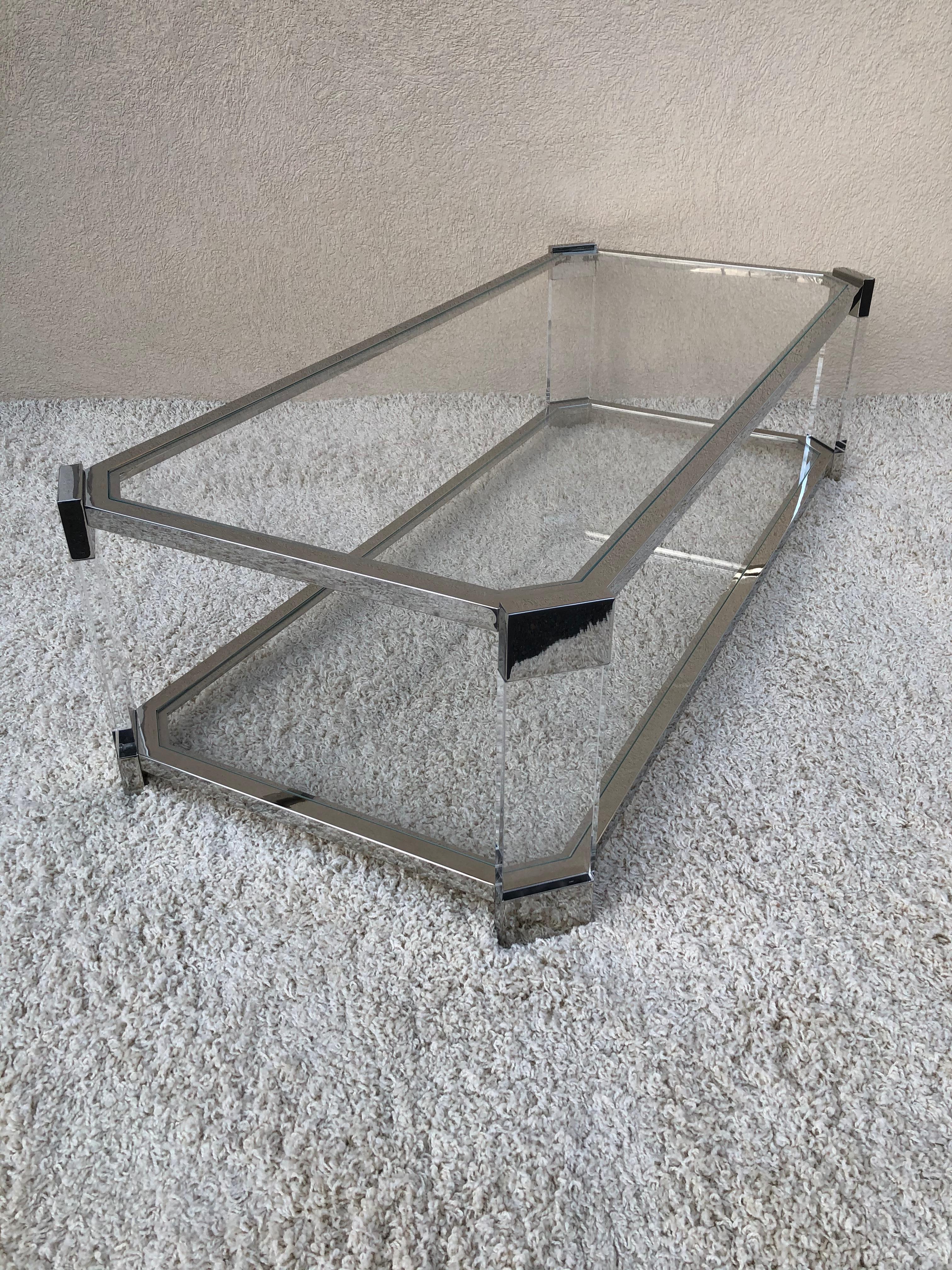 Prismatiques polished mirror chrome and Thick Lucite two tiered rectangular
Cocktail table /coffee table with tempered glass inset.
  