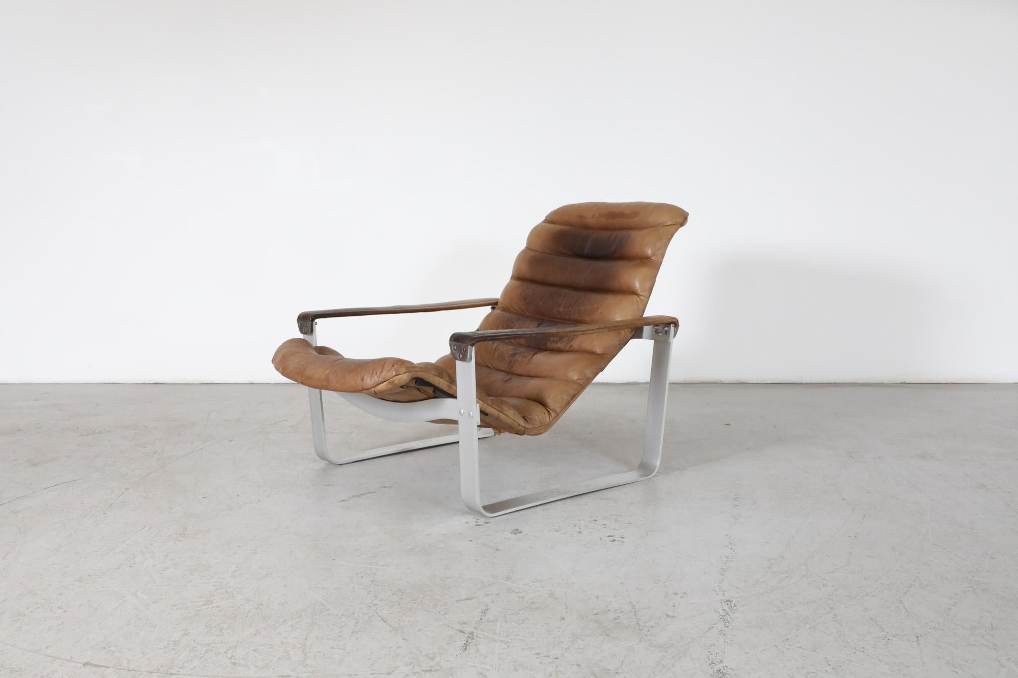 Mid-Century 'Pulkka' leather lounge chair by Ilmari Lappalainen for Asko. Ilmari Lappalainen (1918–2006) first graduated as a woodwork teacher in 1939 and as an interior architect in 1947. After graduation, he got a designer's position at the Asko