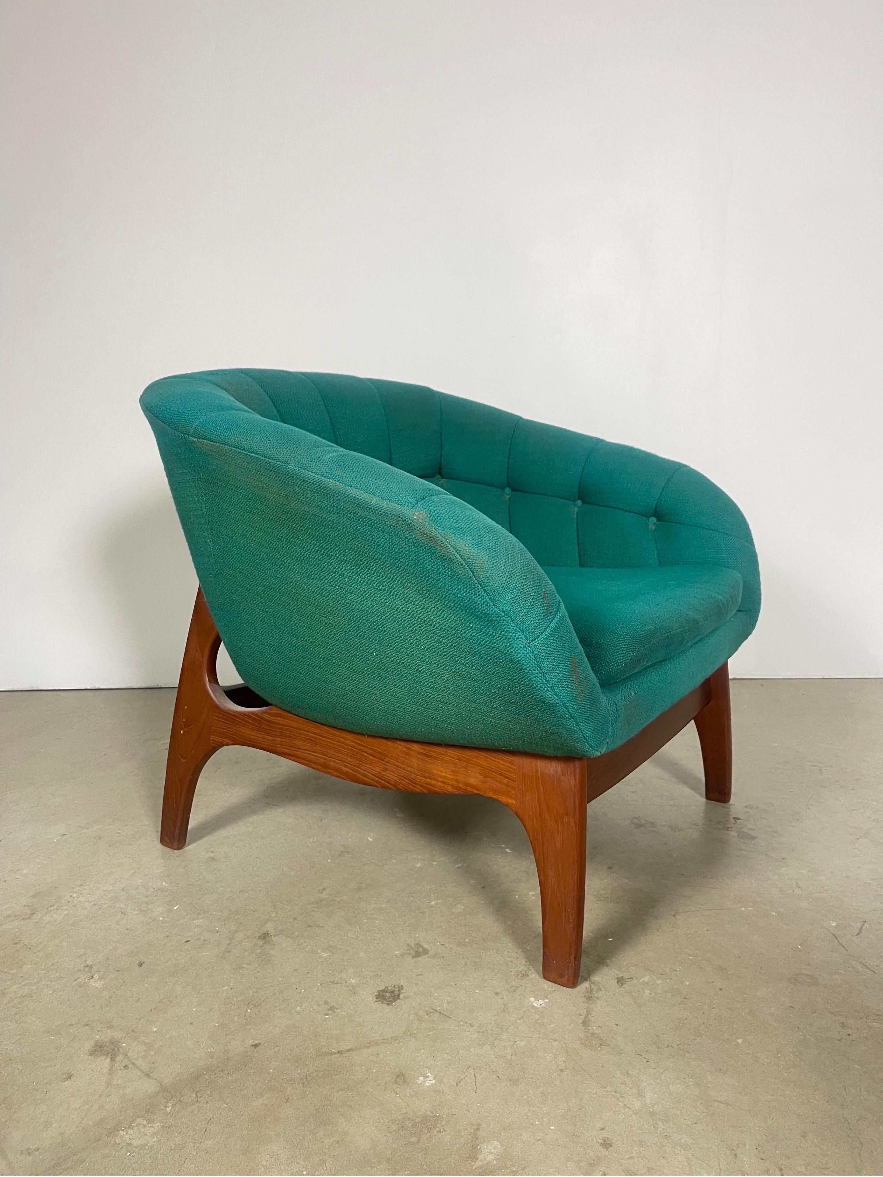 Experience Canadian modernism with this R. Huber chair, perfectly preserved in its original mid-century condition. 

This piece retains the original tags. In unaltered condition- recommended that upholstery is replaced. Teak frame is solid with no