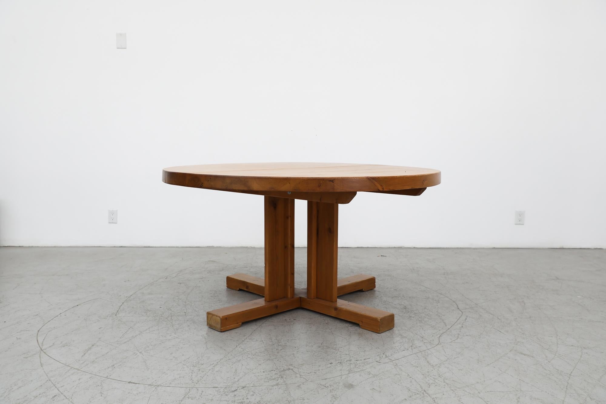 Mid-Century Rainer Daumiller Inspired large solid Pine round dining table with pedestal base. This table is very heavy and sturdy. Lightly refinished with some remaining visible wear consistent with its age and use. Several large pine dining tables