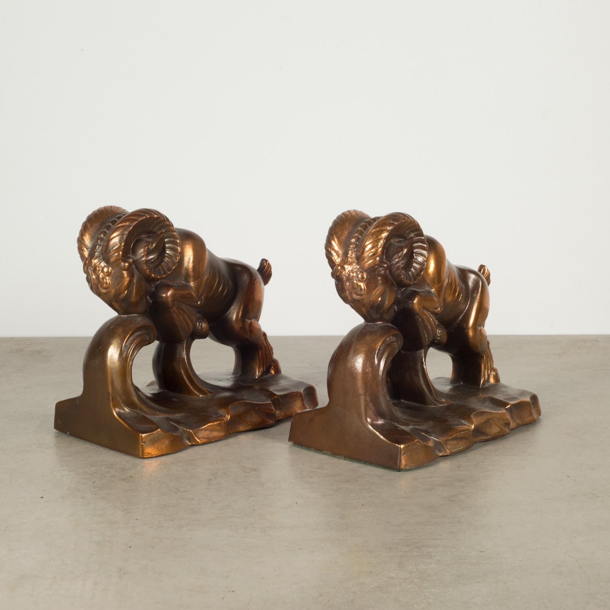 ABOUT

A pair of bronze finish stylized mid-century ram bookends. Both bookends retain their original felt on the bottom.

 CREATOR Unknown.
 DATE OF MANUFACTURE c.1950.
 MATERIALS AND TECHNIQUES Bronze Finish, Felt.
 CONDITION Good. Wear