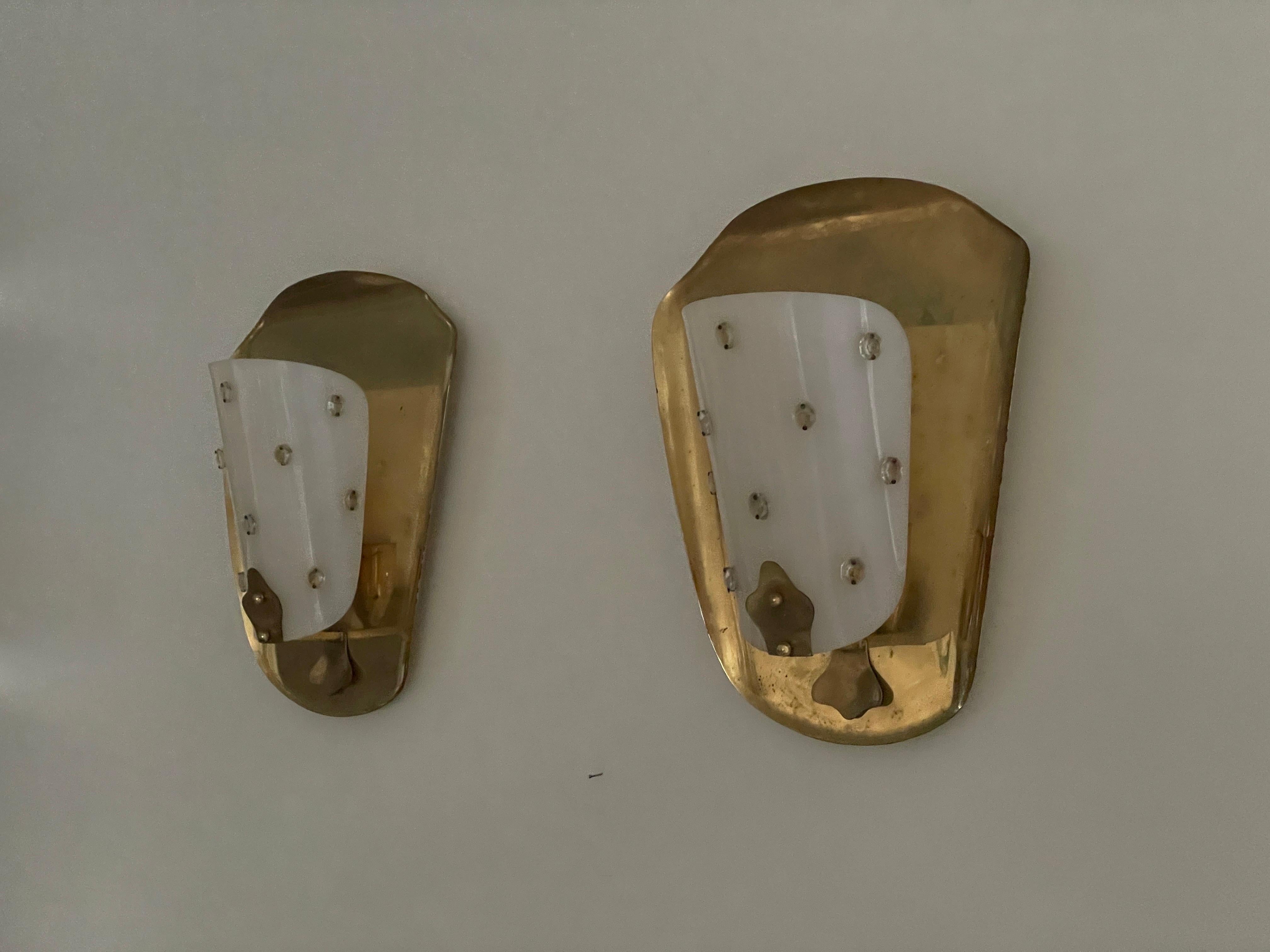 Mid-century Rare Brass & Plexiglass Pair of Cinema Sconces, 1950s, Germany

Very elegant and minimalist wall lamps.
Lamp is in very good condition.

These lamps works with E27 standard light bulbs. 
Wired and suitable to use in all countries.