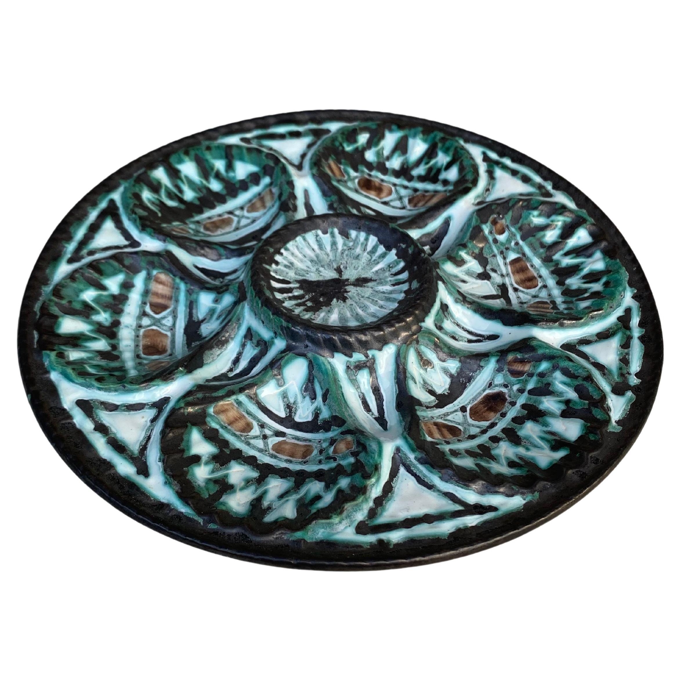 Rare Oyster Plate signed Robert Picault.
Robert Picault (1919 - 2000) was born in Vincennes, Paris and studied at the School of Applied Arts in Paris. After the war he spent a short time teaching drawing and in 1945 he and his schoolfriends Roger
