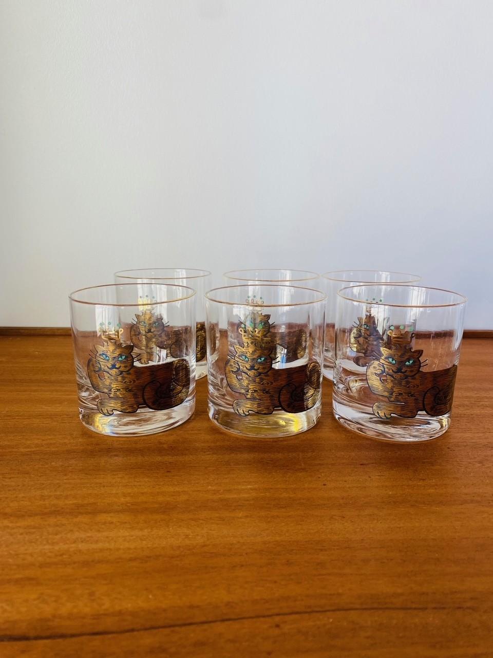 Very rare glasses by Couroc.  This great set includes 6 glasses with a king cat design in each glass.  The beautiful design is whimsical and modernist at the same time. A matching serving tray (sold separately) enhances this pieces.  Chic,