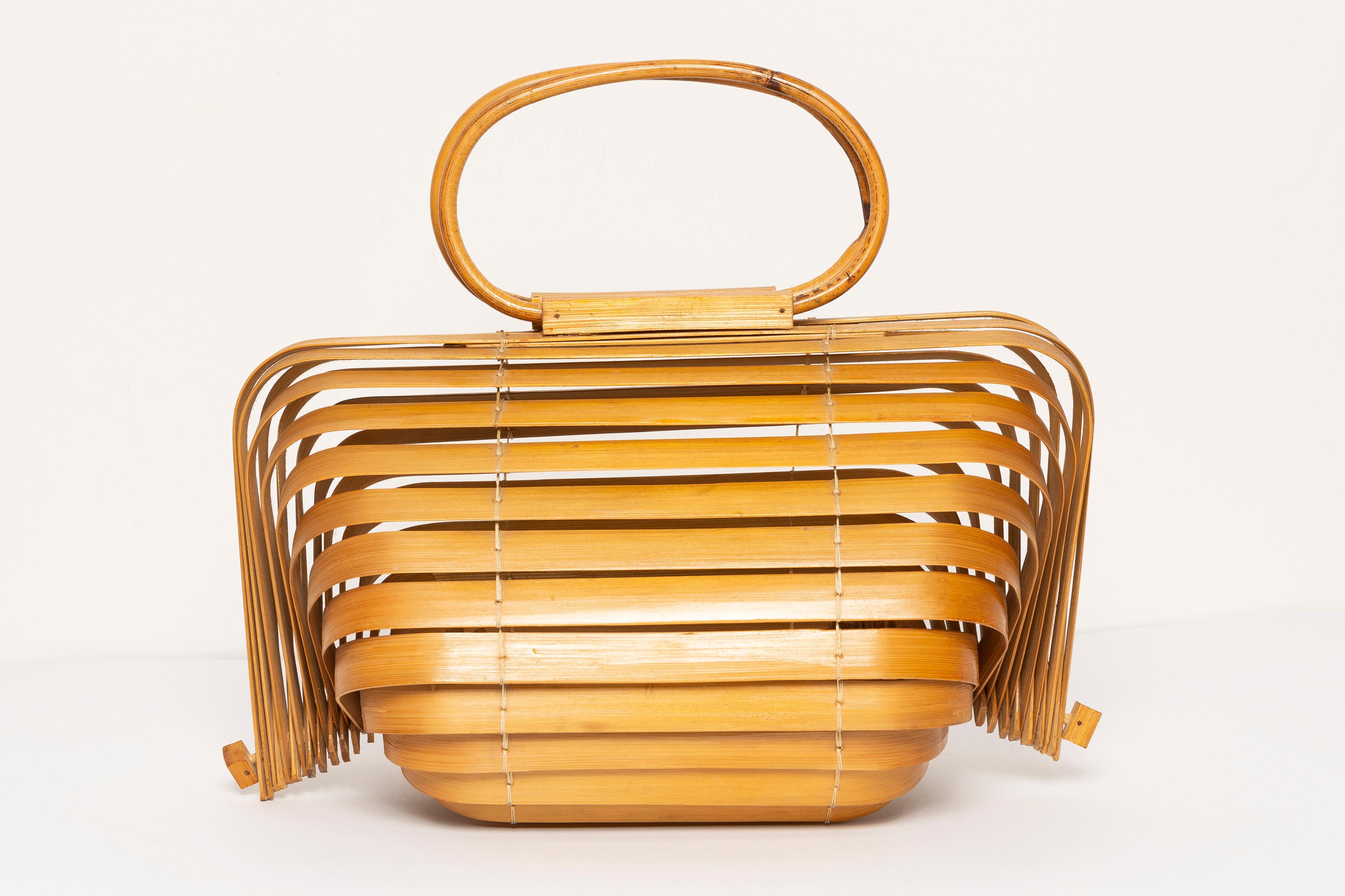 A Japanese-inspired slatted bag. It in very good condition, the wood is complete, without any breaks or losses. Absolutely amazing only one unique piece. Produced in 1960s in Poland, Europe. 



