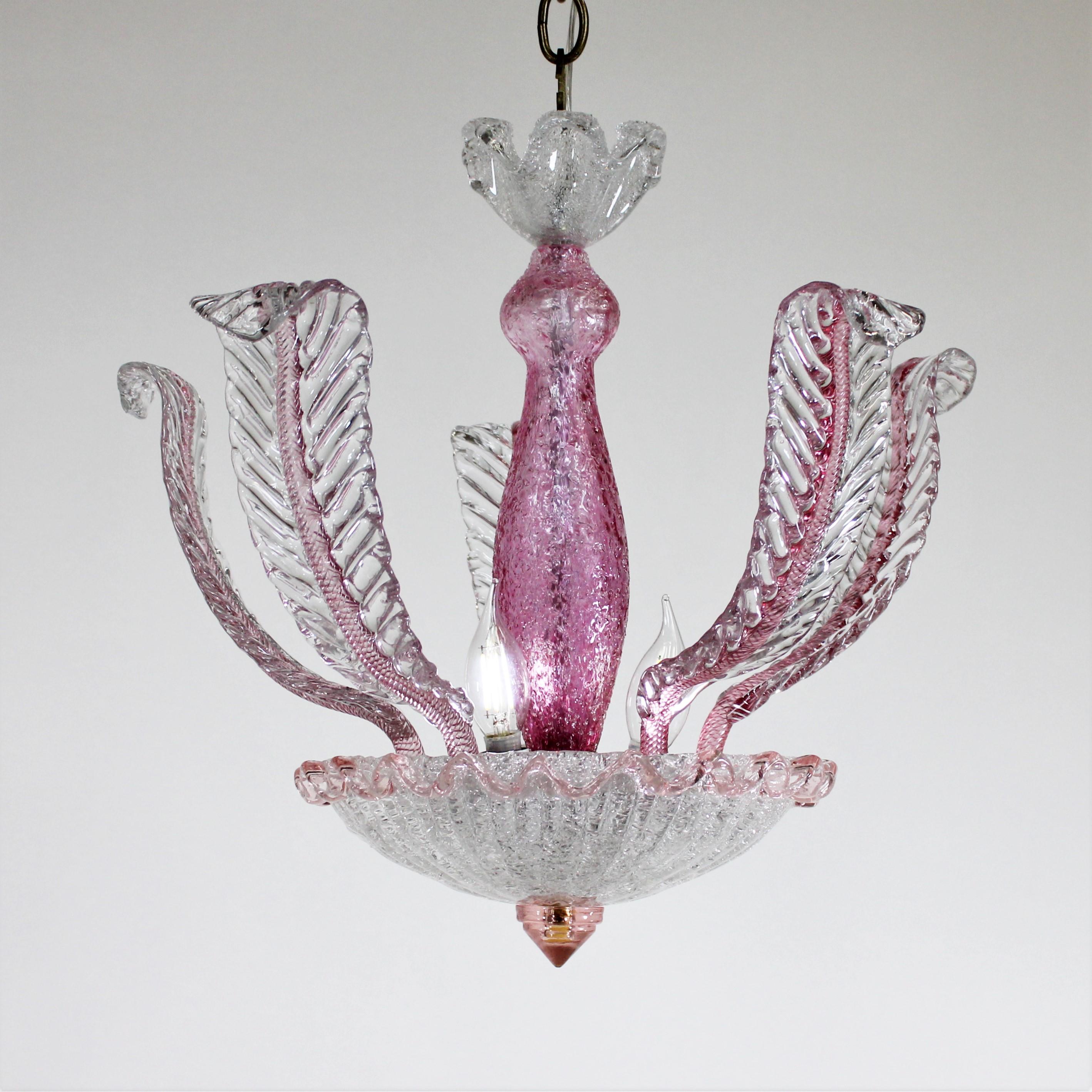 Elevate your interior with this exquisite mid-century Murano ceiling light, a true testament to Venetian glass craftsmanship. This stunning ceiling lamp features a harmonious blend of clear, colorless Venetian glass and vibrant reddish-raspberry