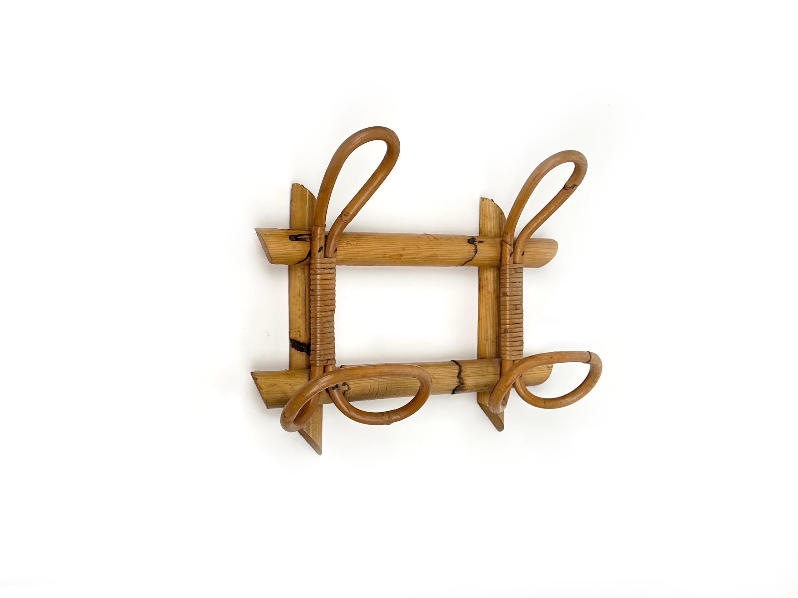 Coat rack stand in bamboo and rattan with two hooks. 

Made in Italy in the 1960s.