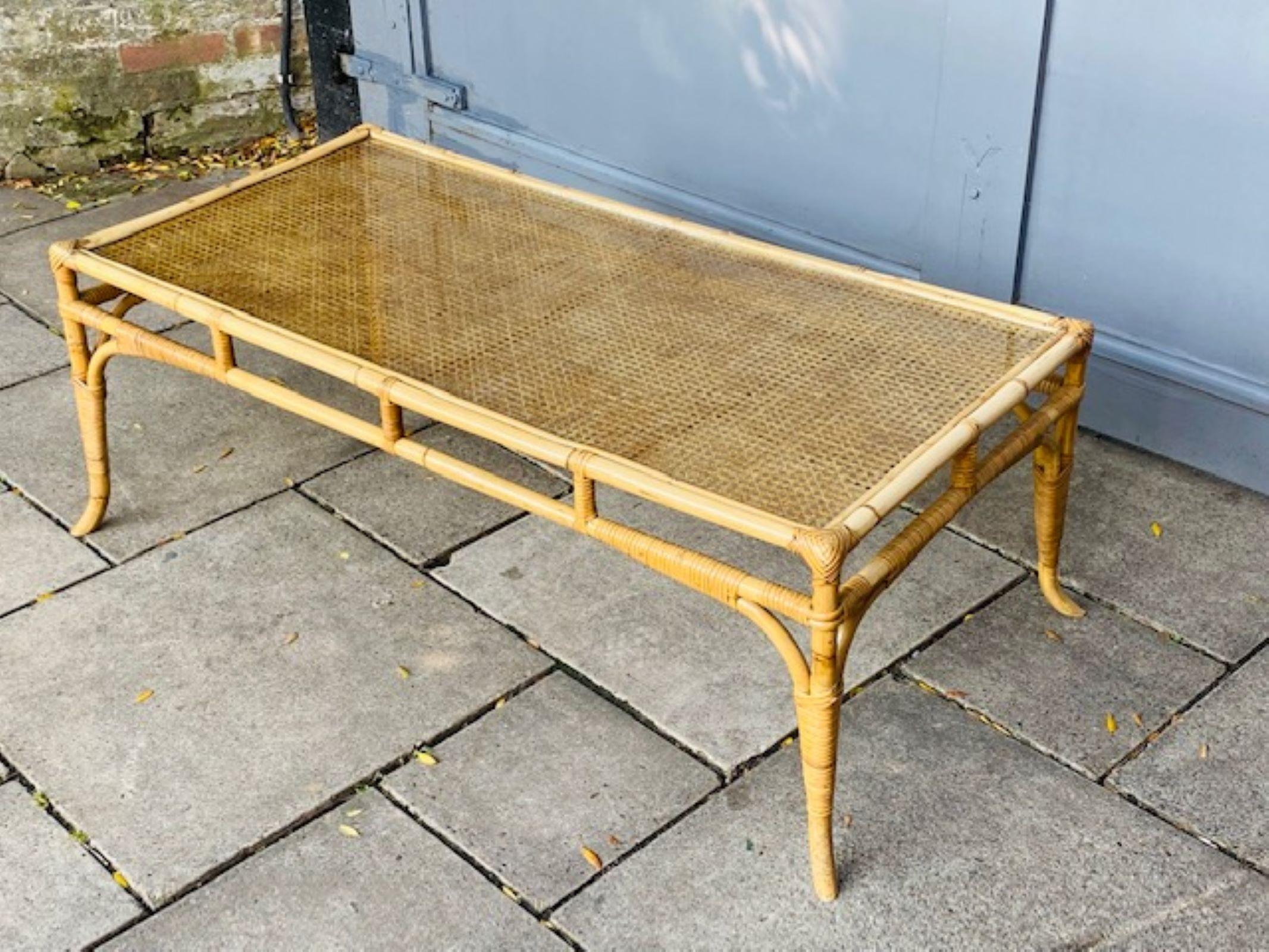 Mid Century Rattan and Bamboo Coffee Table with Glass Top, Italian, 1970

Mid Century Rectangular Rattan and Glass Top Coffee / Lounge Table
This large rattan coffee table has four legs which splay out slightly at the feet. The top has cane weave