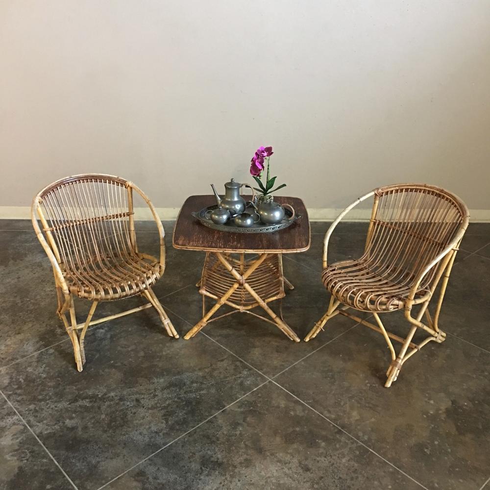 This charming midcentury rattan table is ideal for any casual seating area. The square top sits above a magazine holder stretcher finished with rattan wrapping. As of this writing, a matching pair of bamboo armchairs are available! Hurry now to get