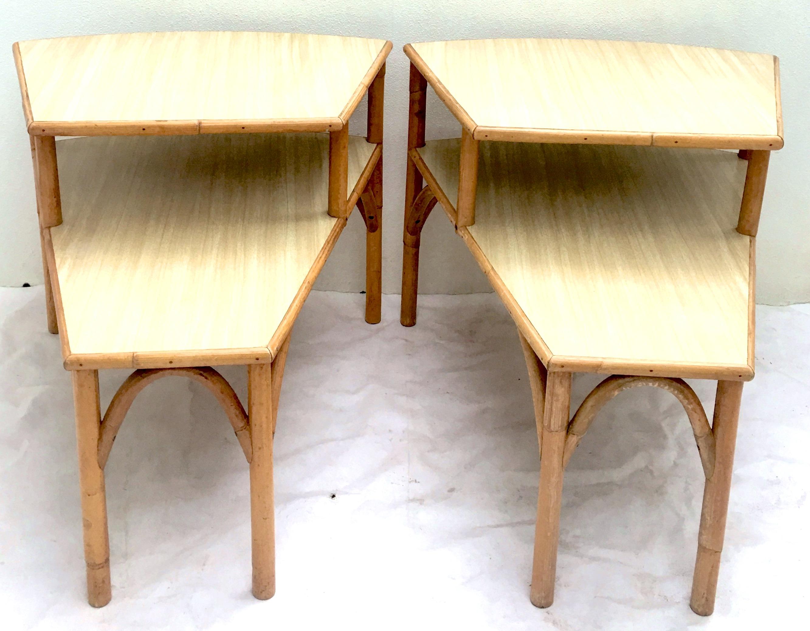 Quintessential Mid-Century Modern honey rattan two-tier side tables with monochromatic laminate tops.
Dimensions:
Height of lower tier, 17