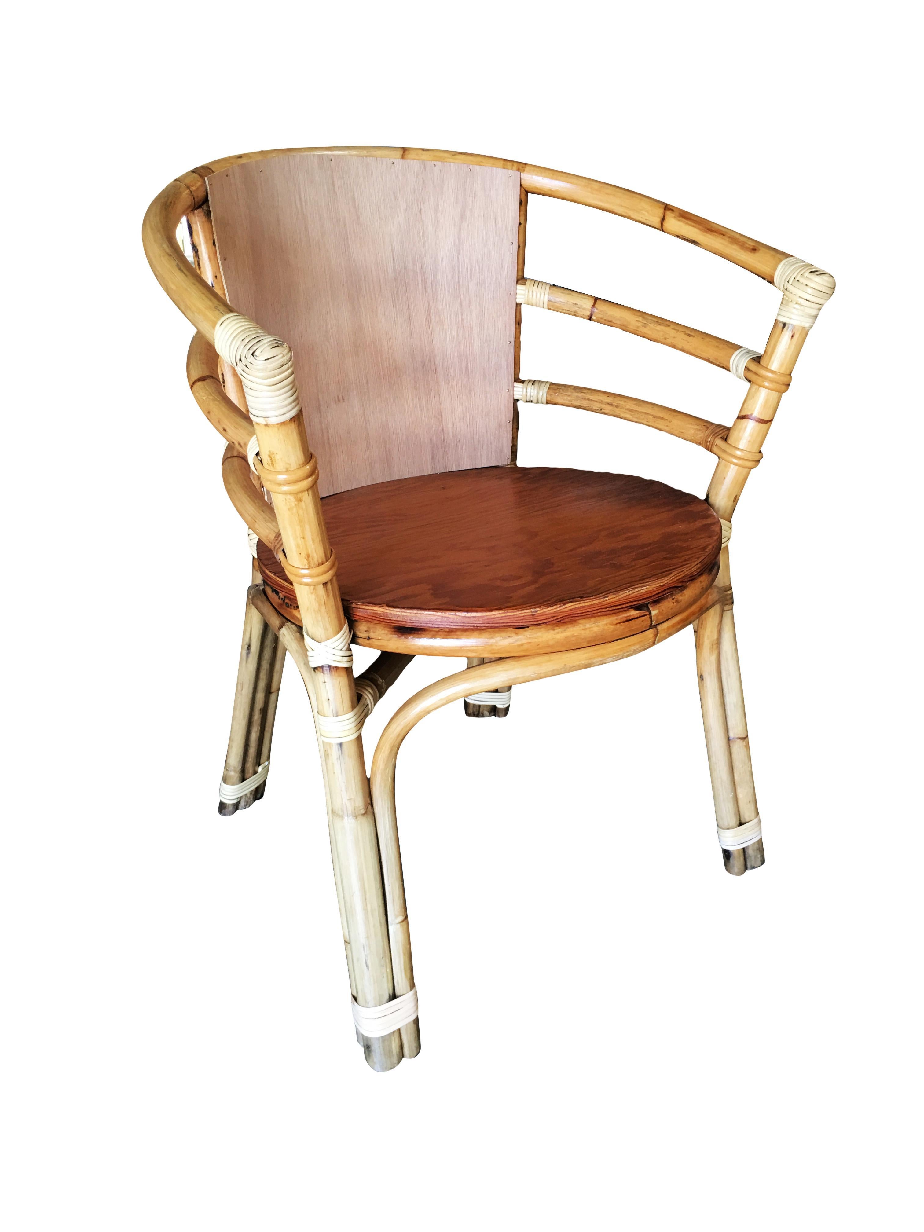 Single strand rattan barrel back armchair with skeleton arms. 
Restored to new for you. All rattan, bamboo and wicker furniture has been painstakingly refurbished to the highest standards with the best materials. All refinishing is done by rattan