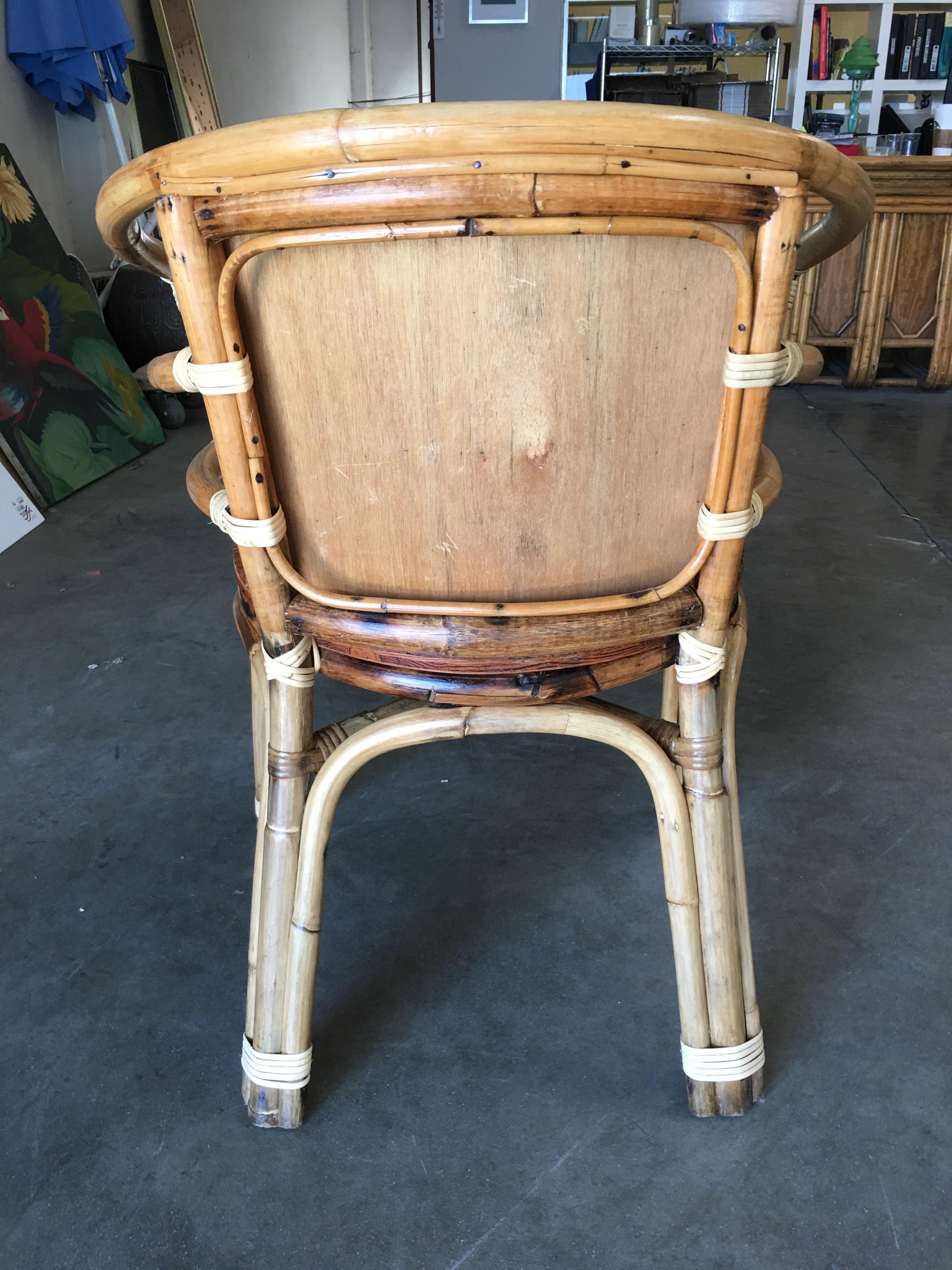 American Mid-Century Rattan Barrel Back Armchair with Skeleton Arms For Sale
